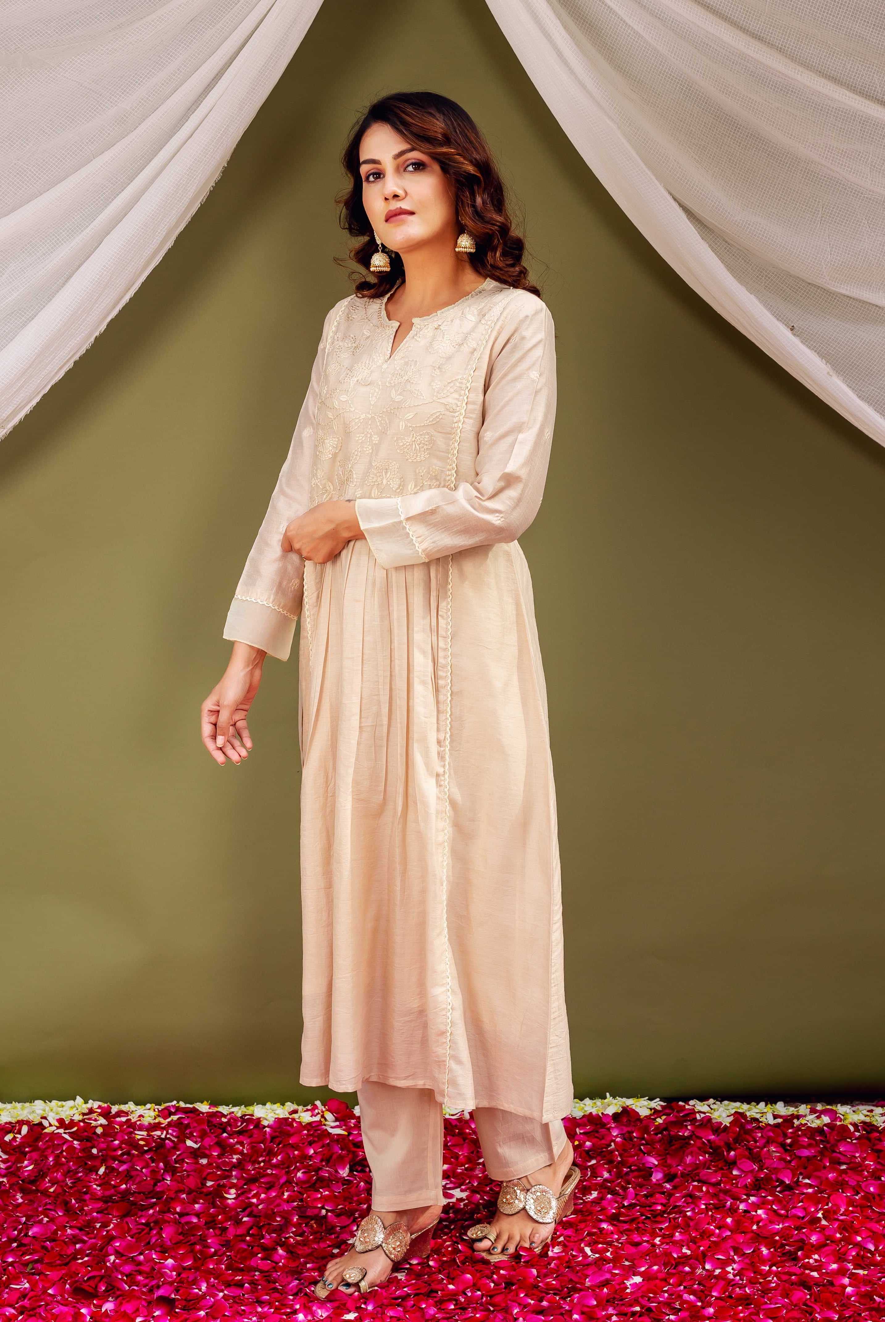 Full-body front shot of a model wearing a light beige Chanderi kurta with intricate front embroidery.
