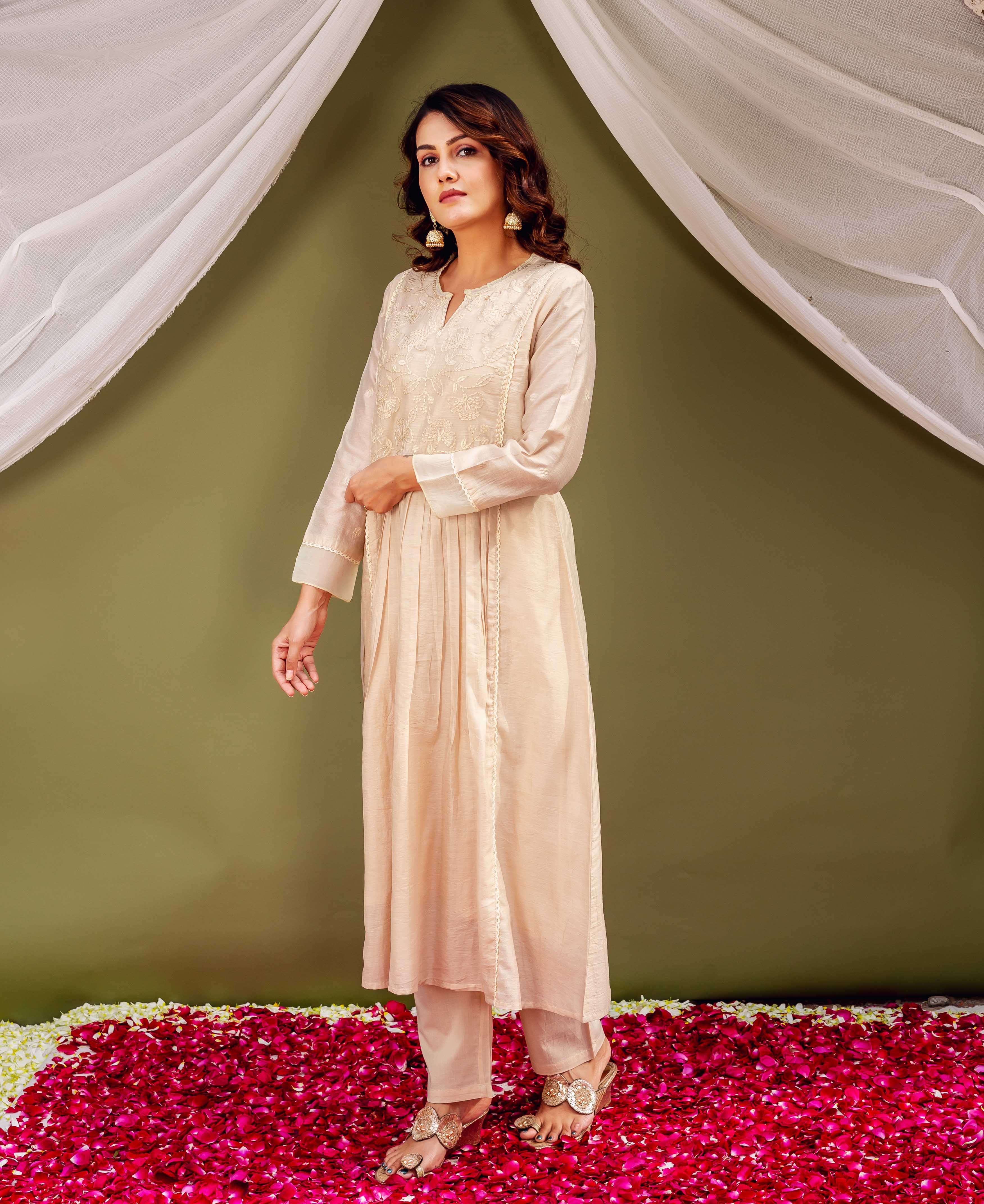 Full-body front shot of a model wearing a light beige Chanderi kurta with intricate front embroidery.