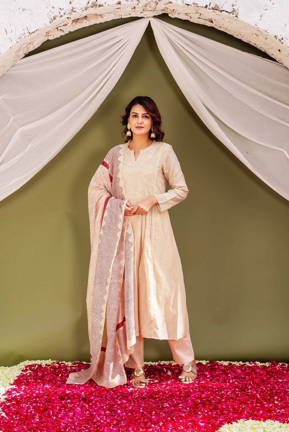 Full-length model in beige ethnic kurta set with maroon geometric block-printed dupatta.