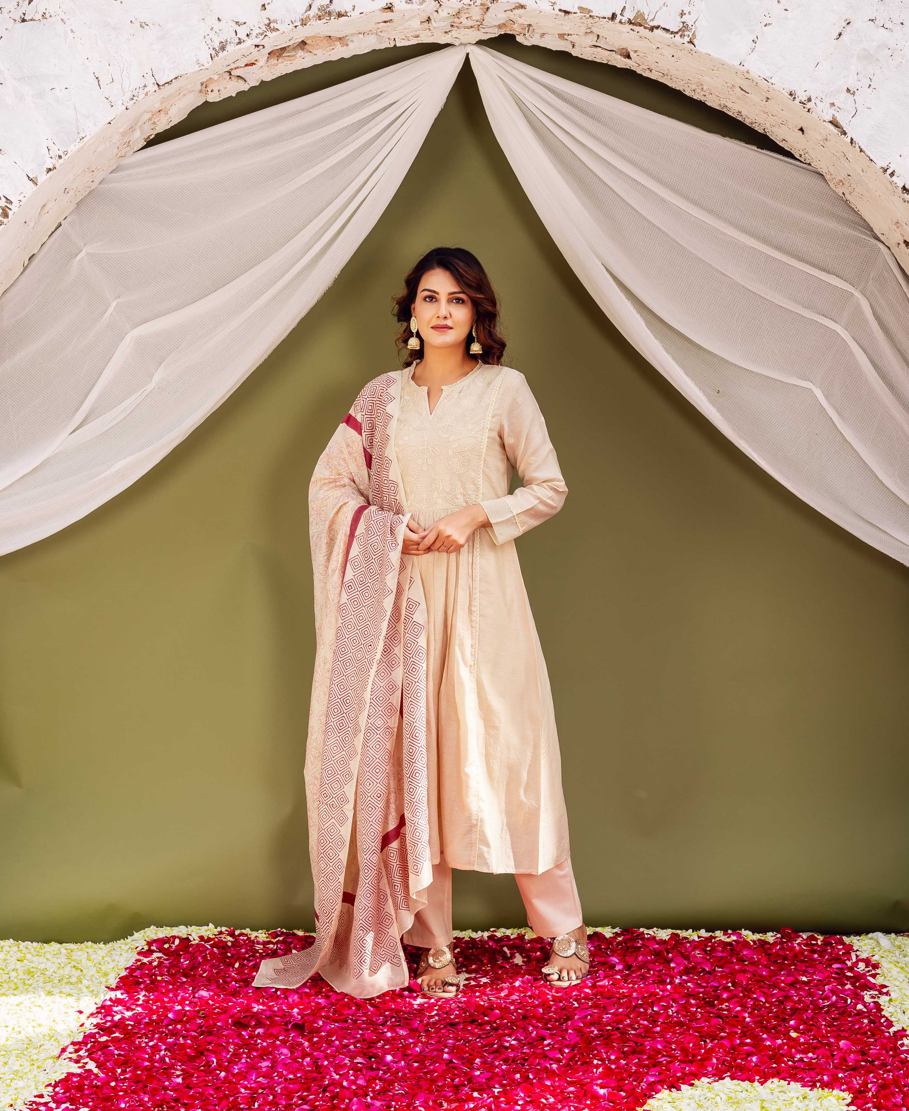 Full-length model in beige ethnic kurta set with maroon geometric block-printed dupatta.