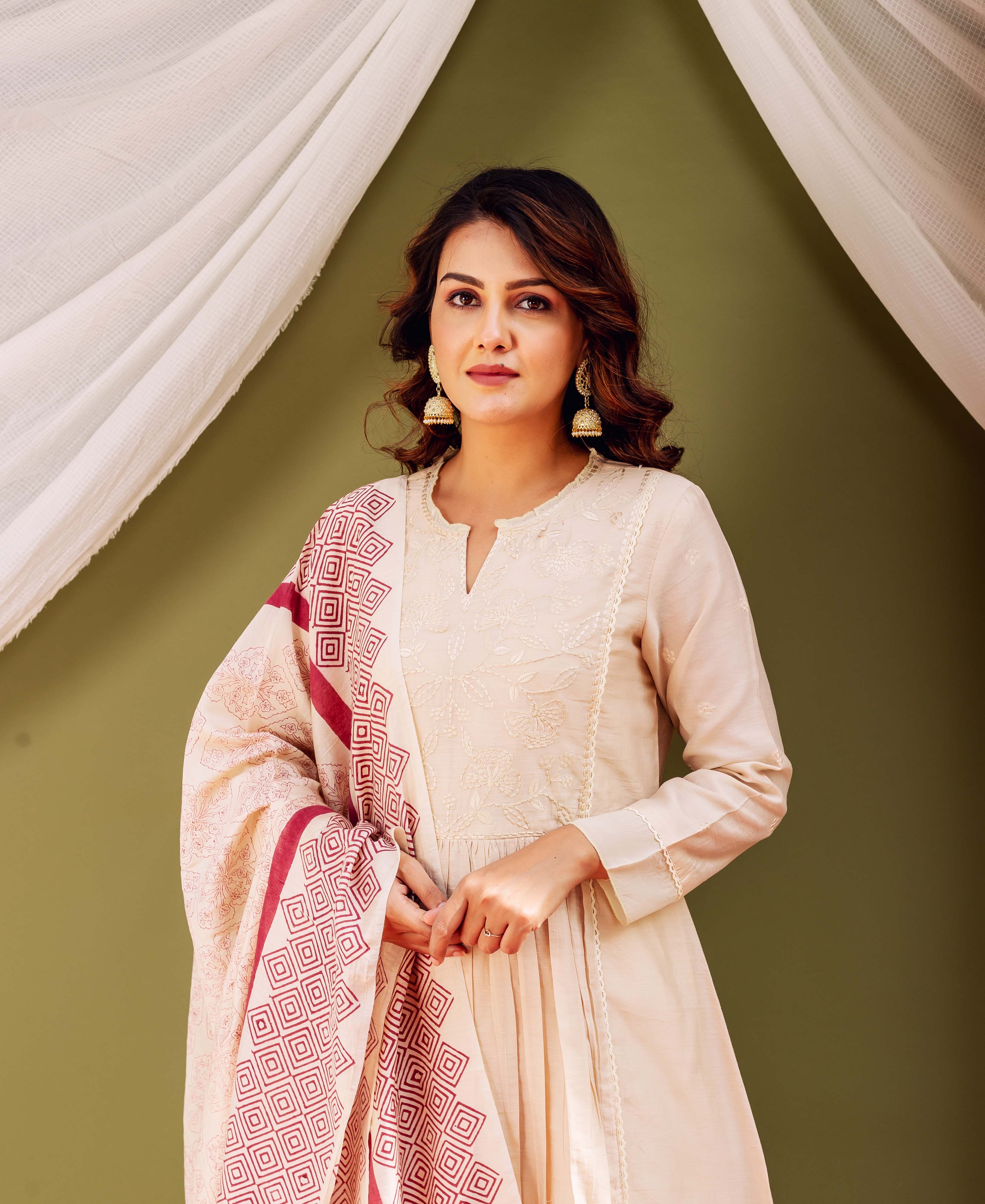 Model in sandstone Chanderi kurta with embroidery and red geometric block-printed dupatta.