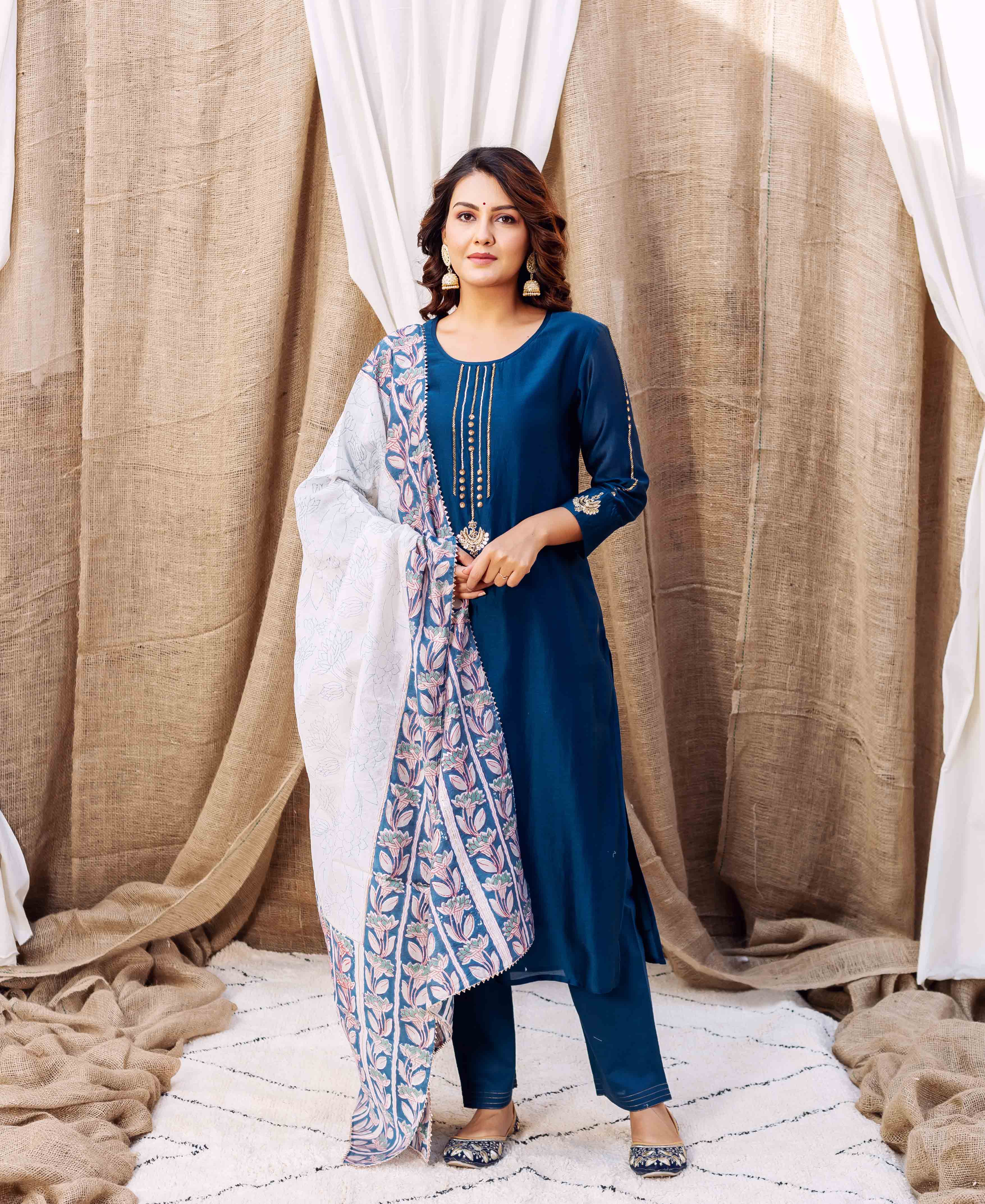 Front-facing model showcases a white dupatta with broad blue and pink floral hand-block print.
