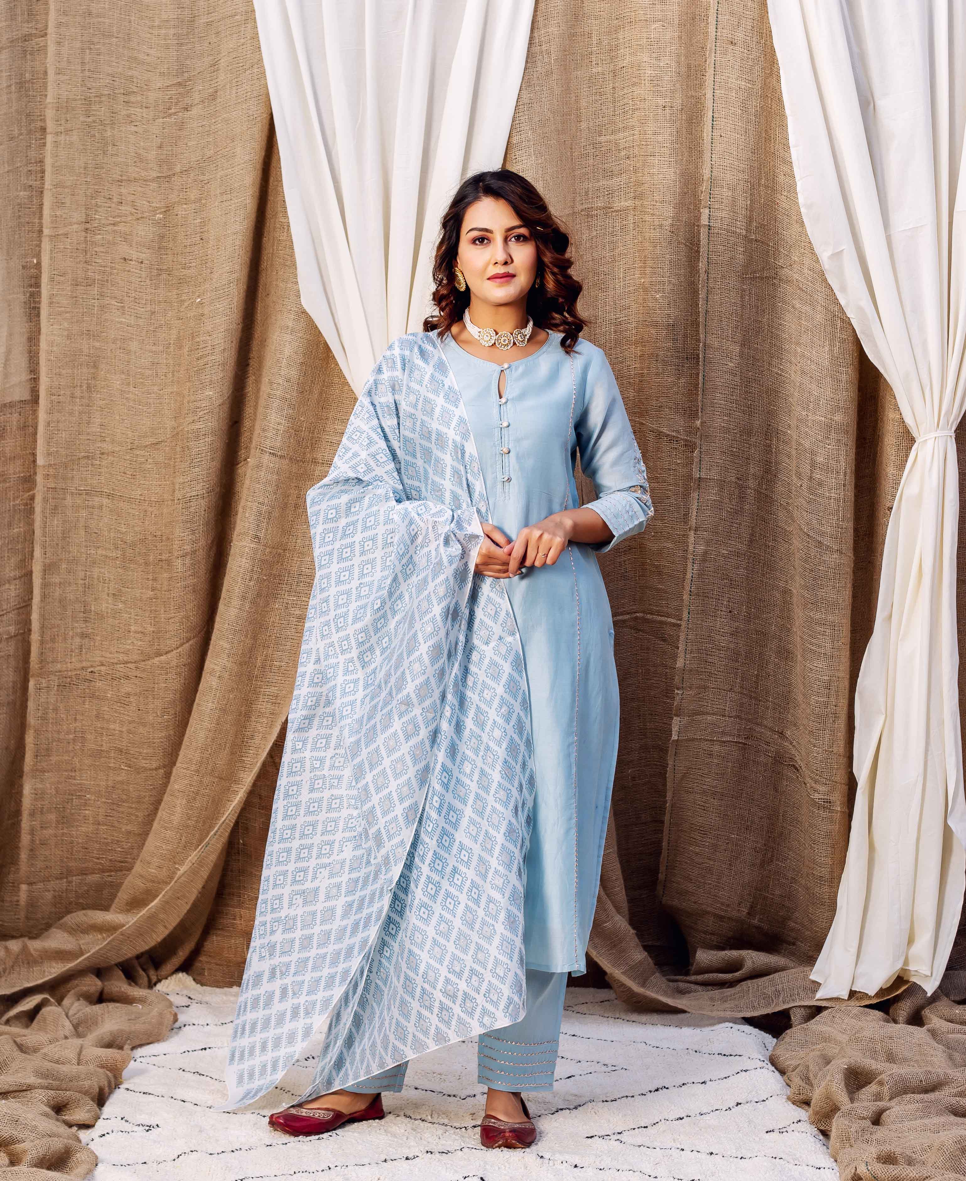 Light blue silk chanderi kurta with white and blue patterned dupatta on a model standing.