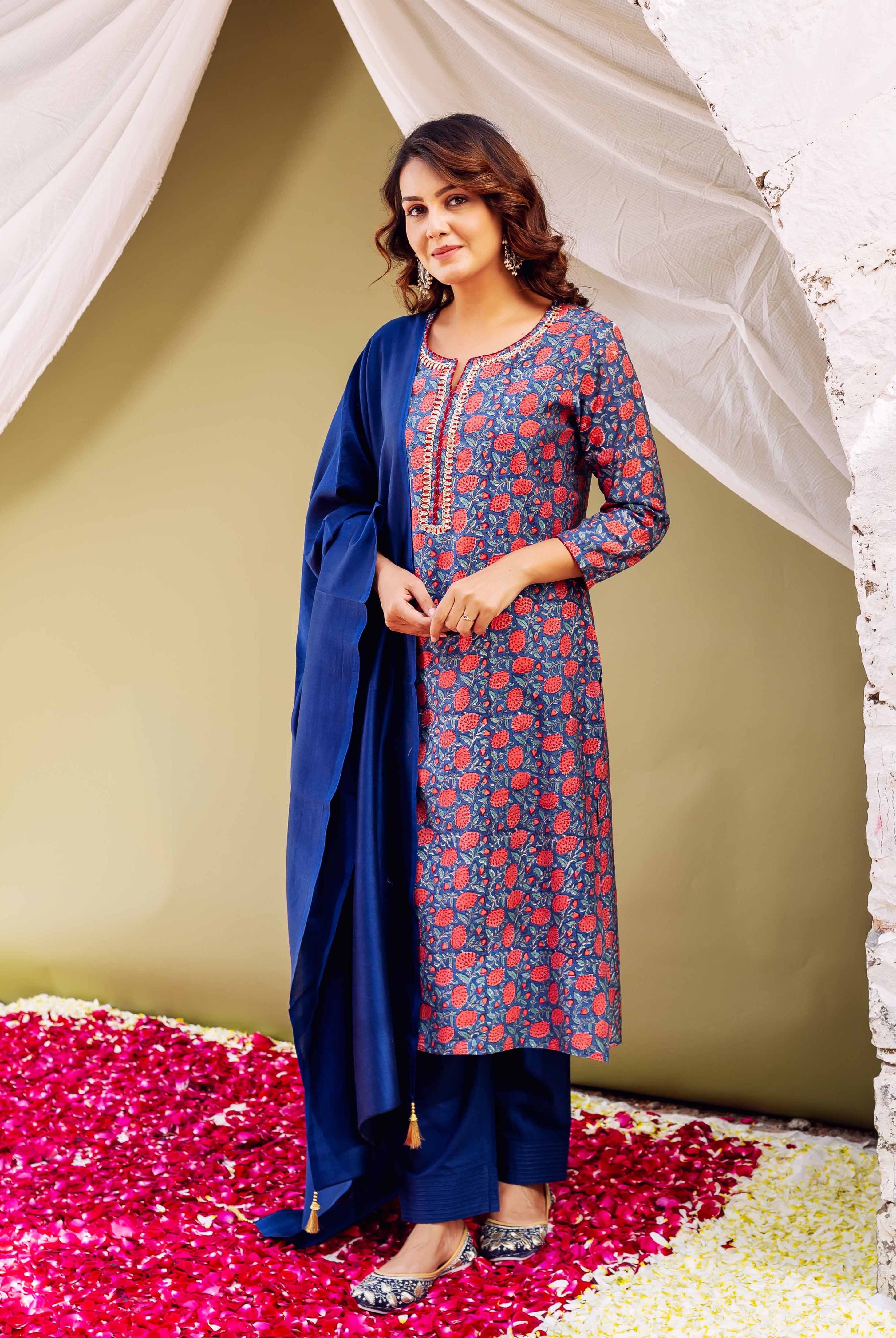 Front view model in blue hand-block printed kurta with red flowers, matching blue pants, and dupatta.
