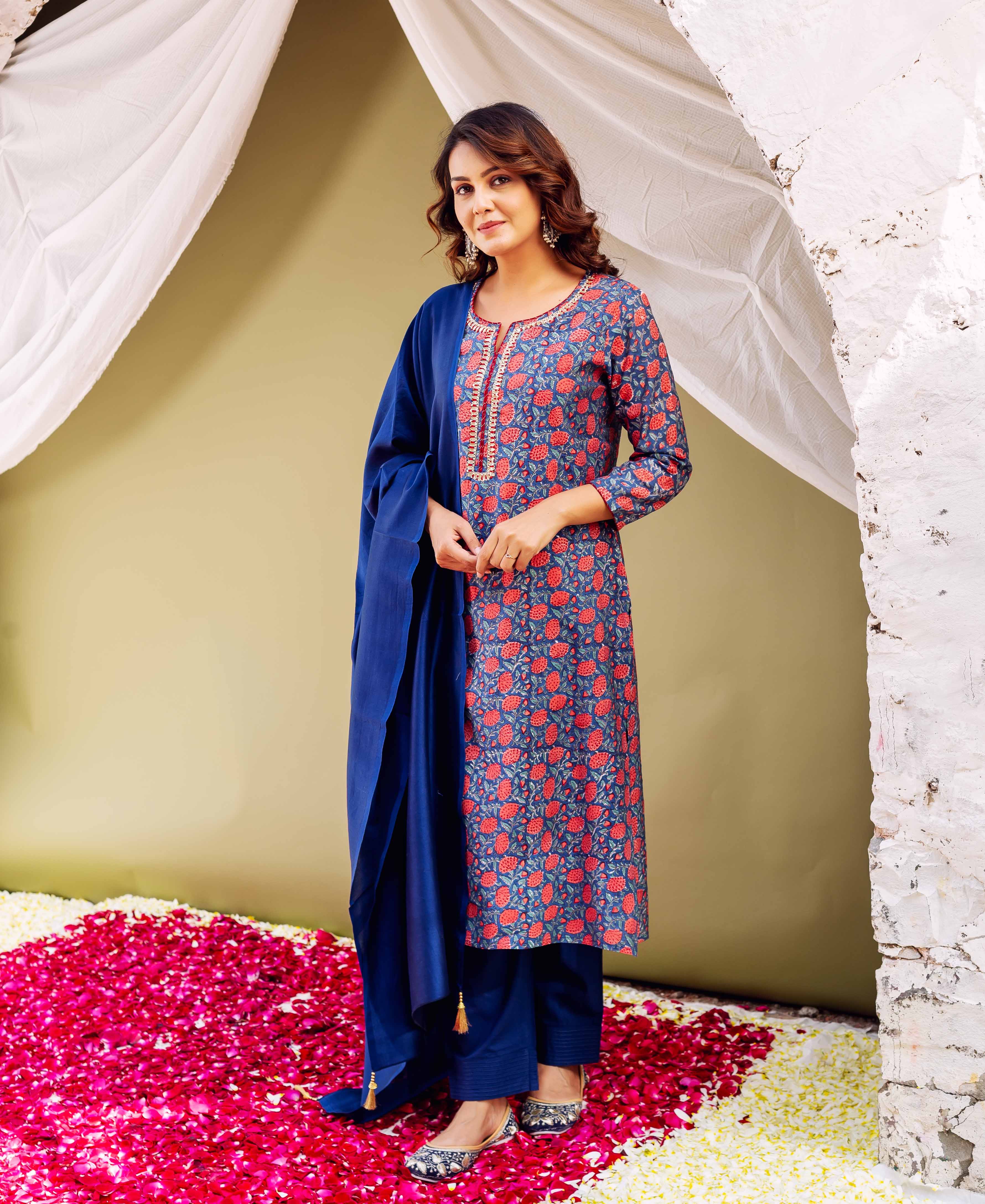 Front view model in blue hand-block printed kurta with red flowers, matching blue pants, and dupatta.