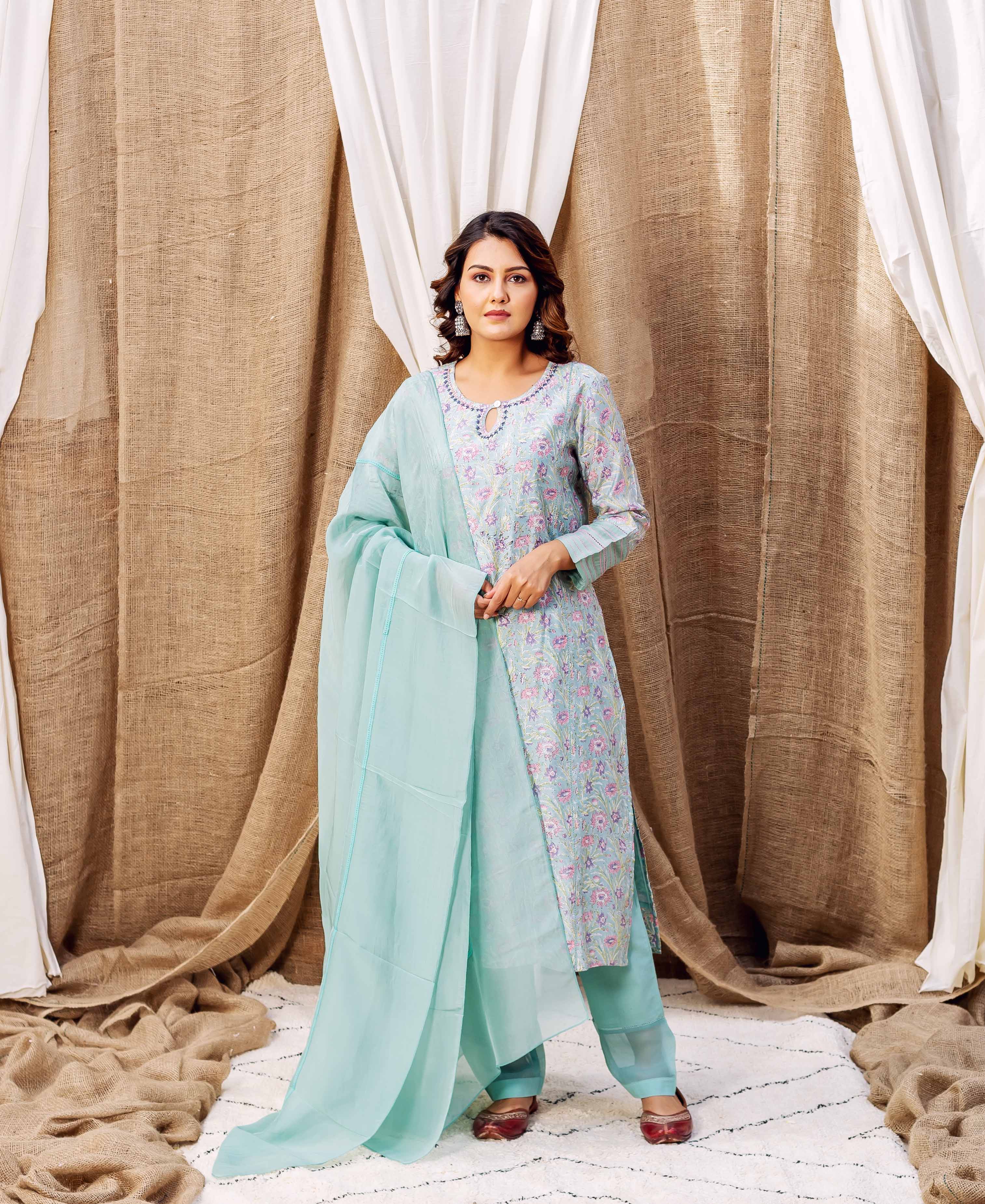 Full front view of model in a sea green hand-printed floral kurta set.