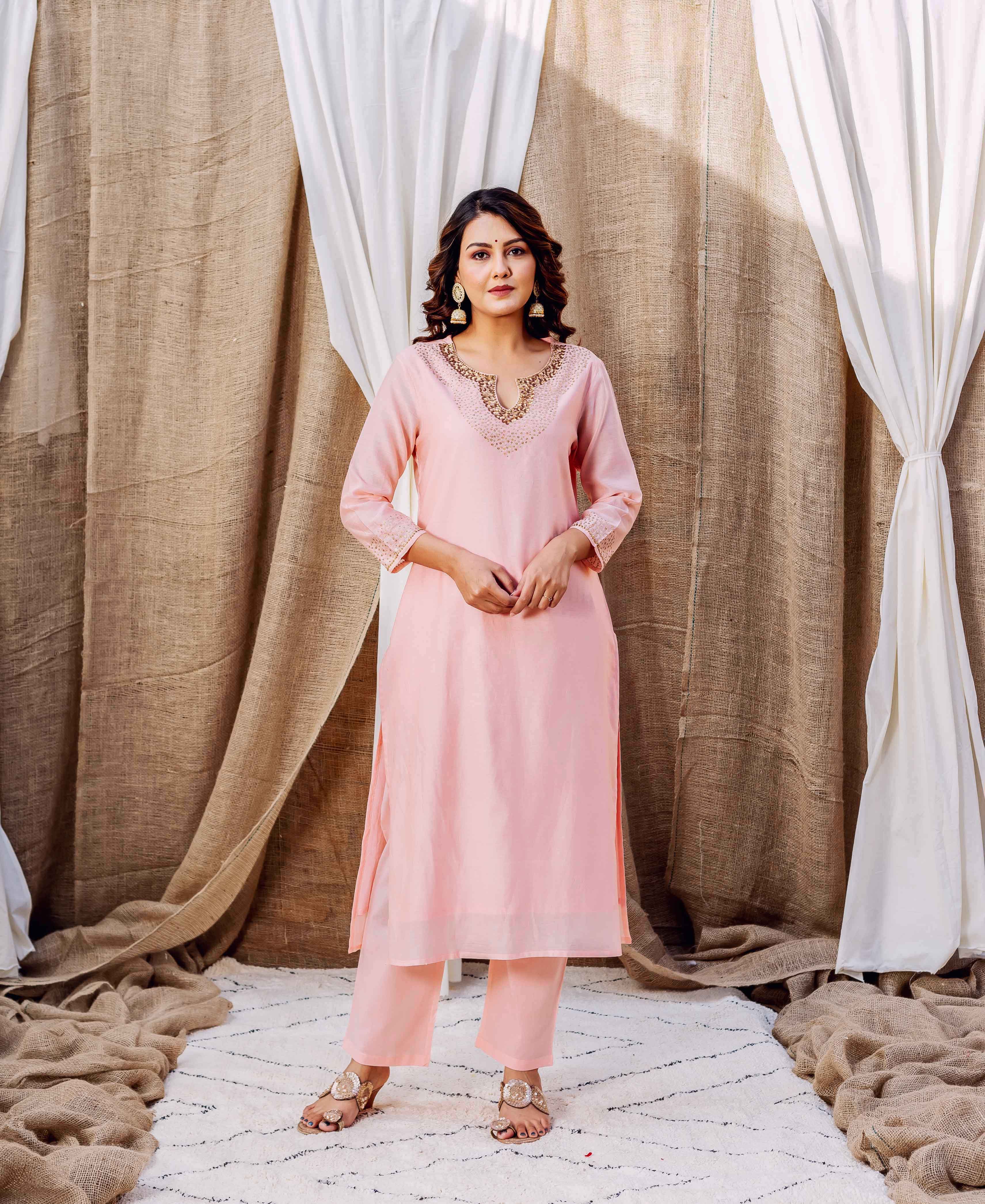 Full-length model shot of a rose Chanderi kurta set with intricate gold embroidered neckline.