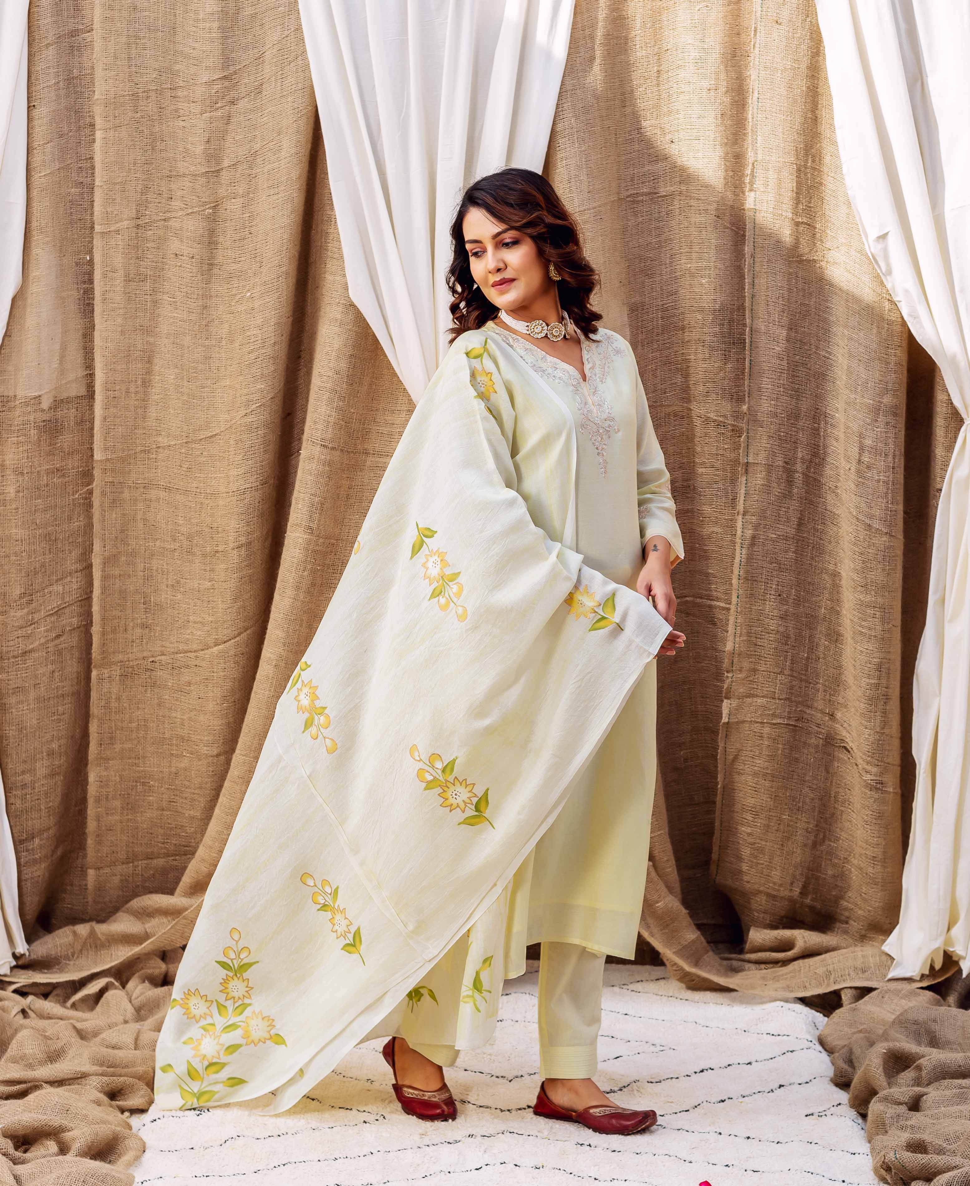 Model wearing yellow ethnic outfit, showcasing hand-block printed yellow floral chanderi silk dupatta.