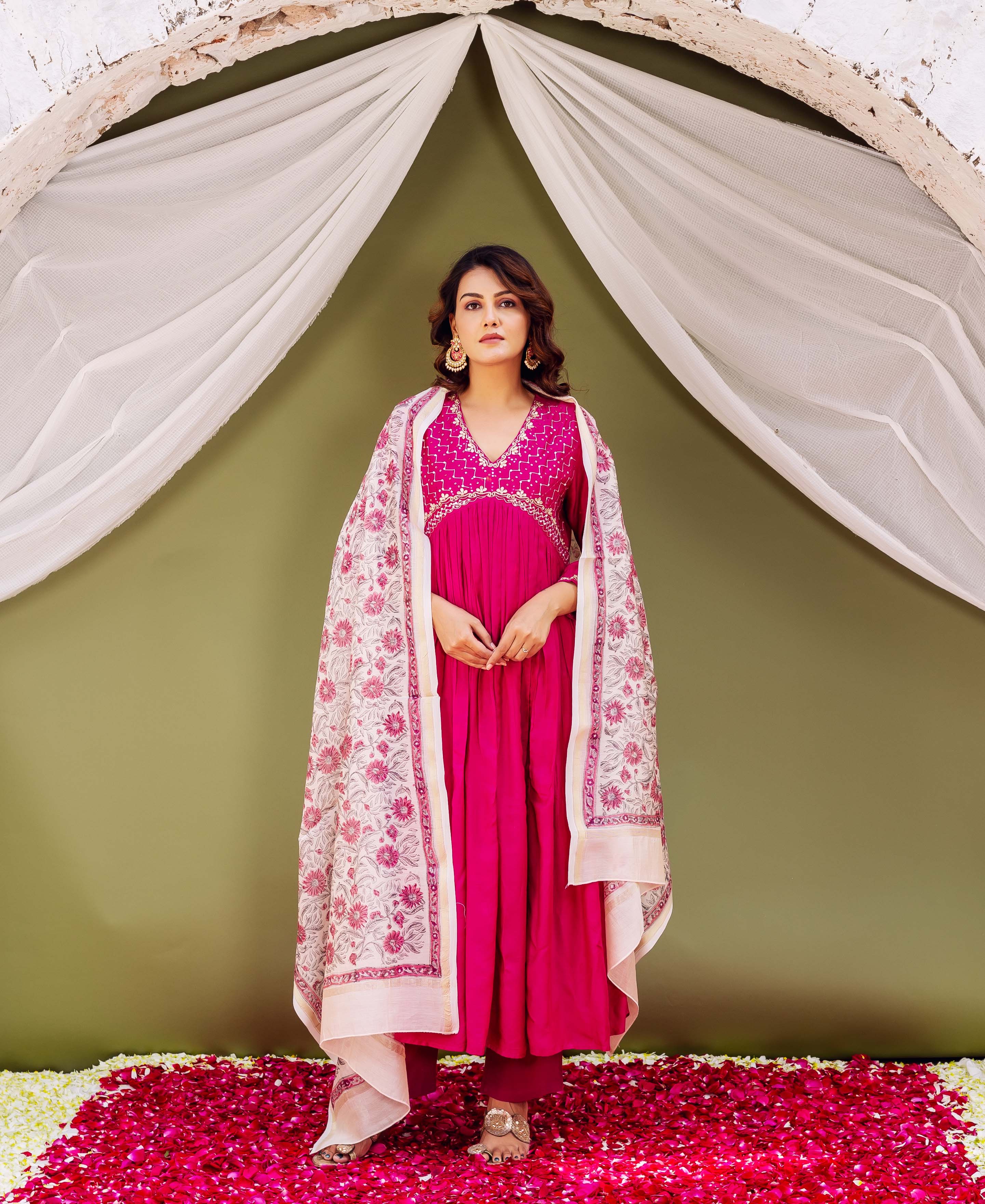 Front view of model wearing a cream hand-block-printed Chanderi silk dupatta with pink florals.