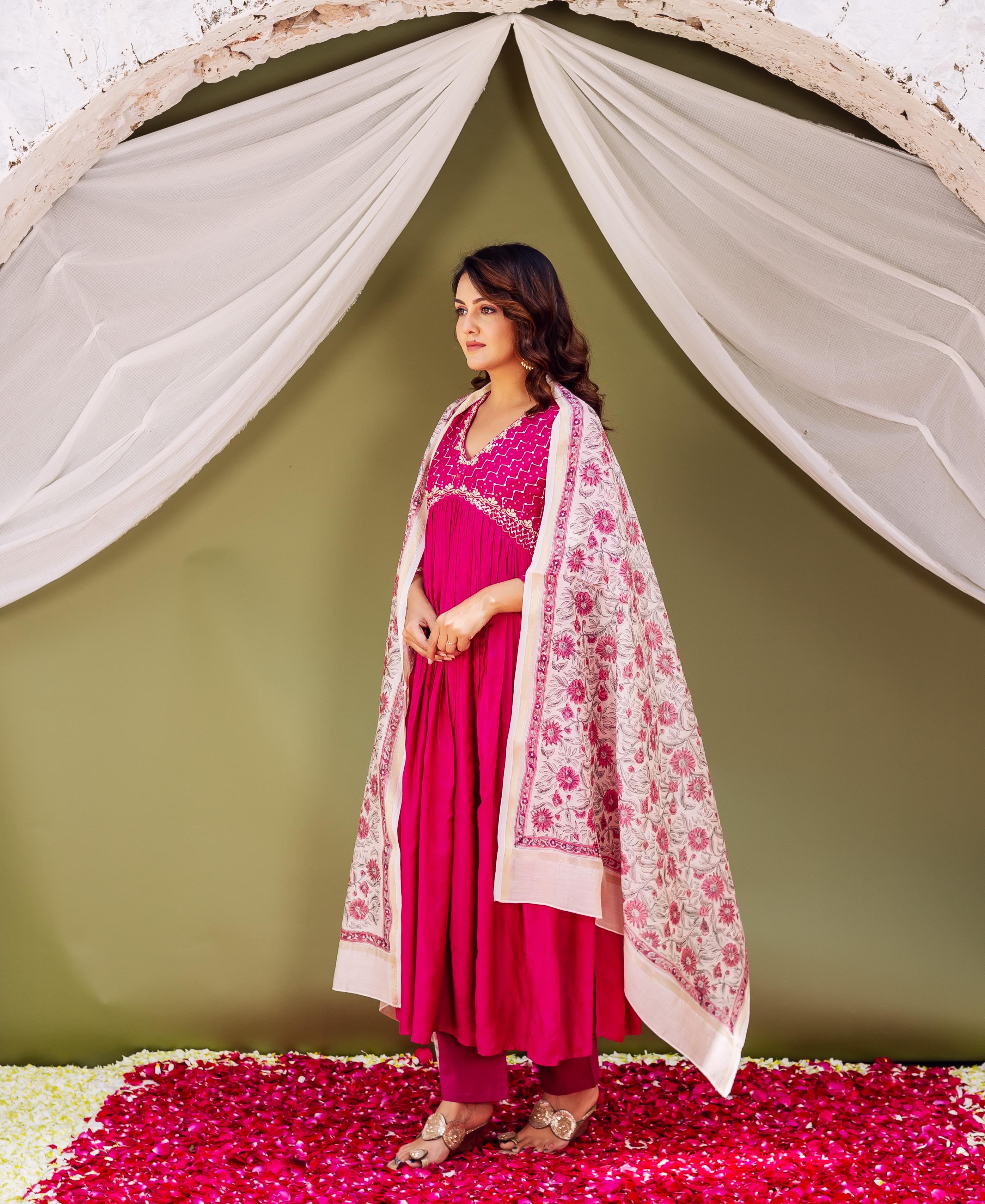 Model wears fuchsia ethnic outfit, showcasing a hand-block printed floral chanderi silk dupatta.