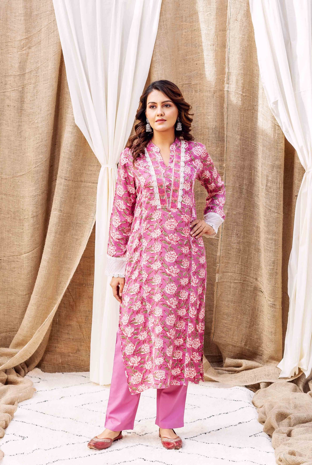 Full-body model in lavender floral hand-block printed kurta set with white lace.