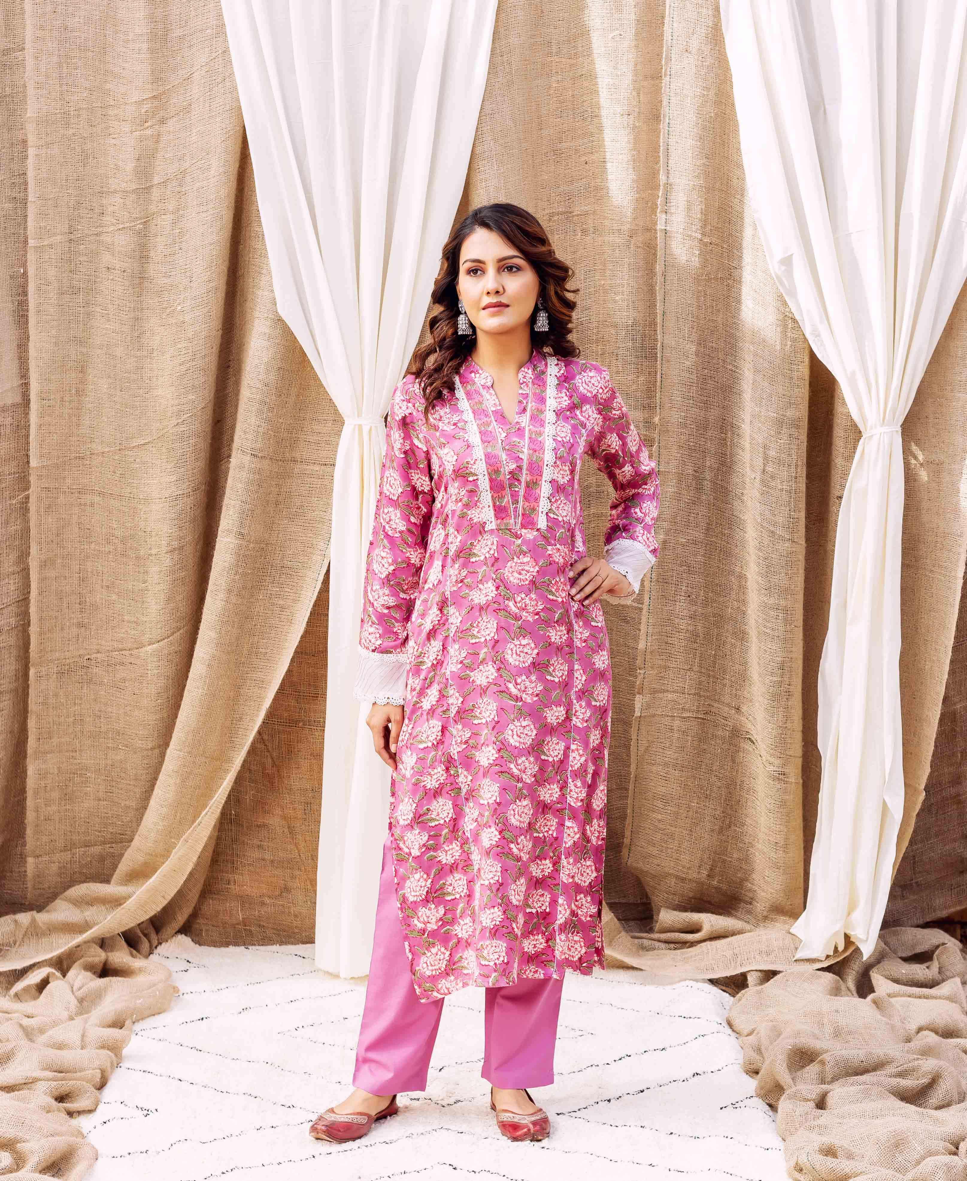 Full-body model in lavender floral hand-block printed kurta set with white lace.