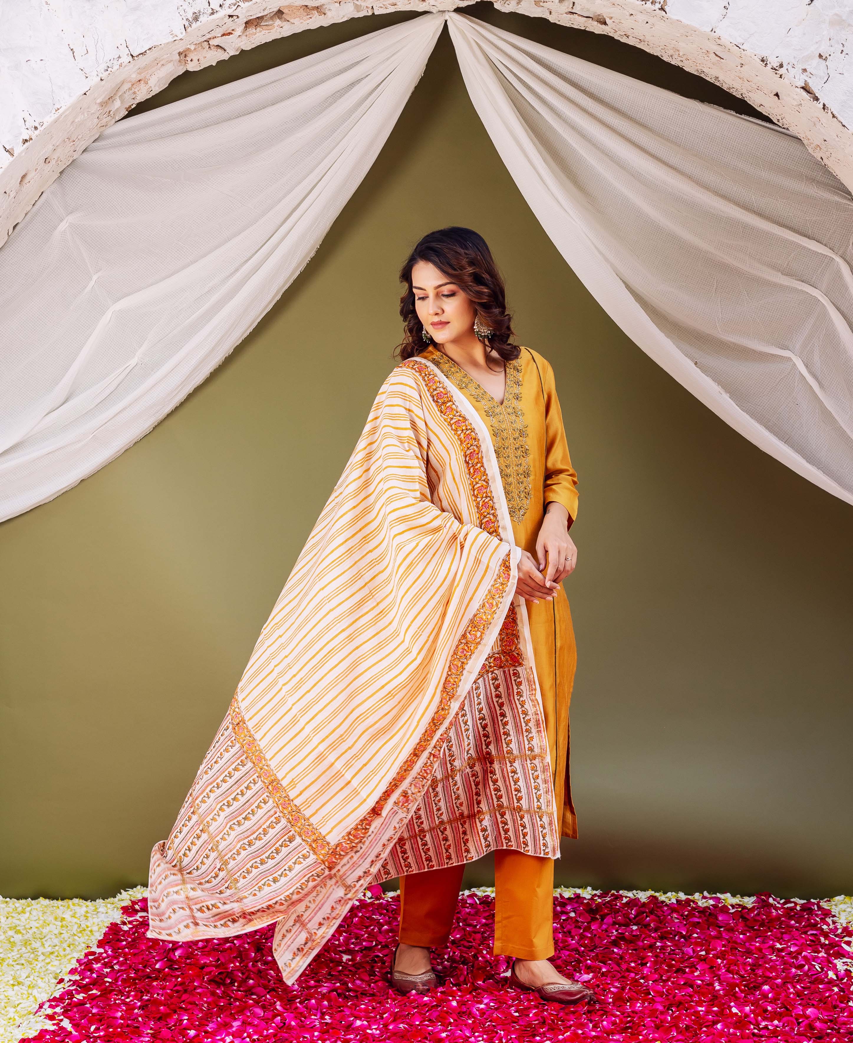 Mustard Silk Chanderi Dupatta with white stripes and intricate red block print, draped on a model.