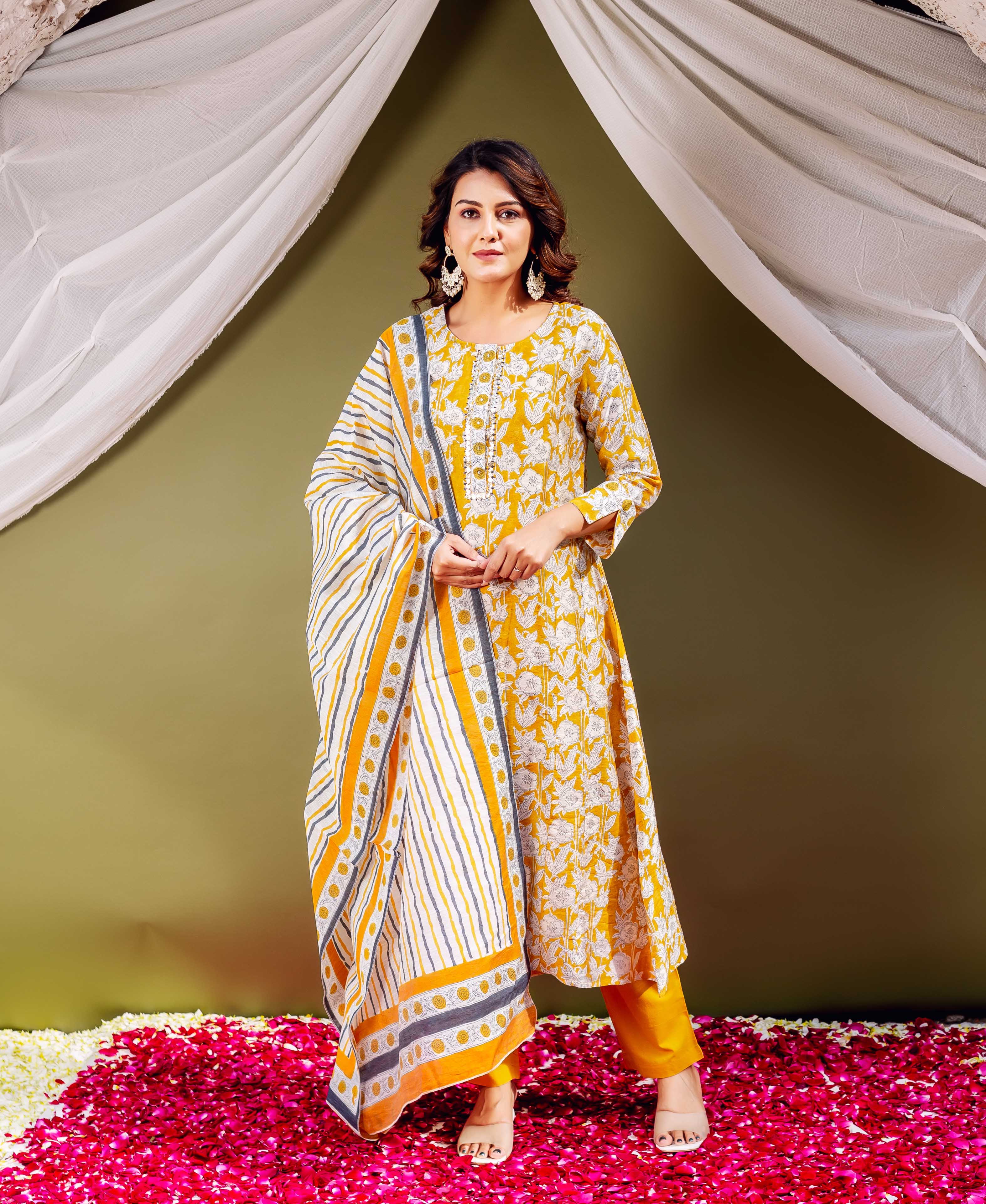 Full-length model wearing sunflower yellow hand block printed striped dupatta.