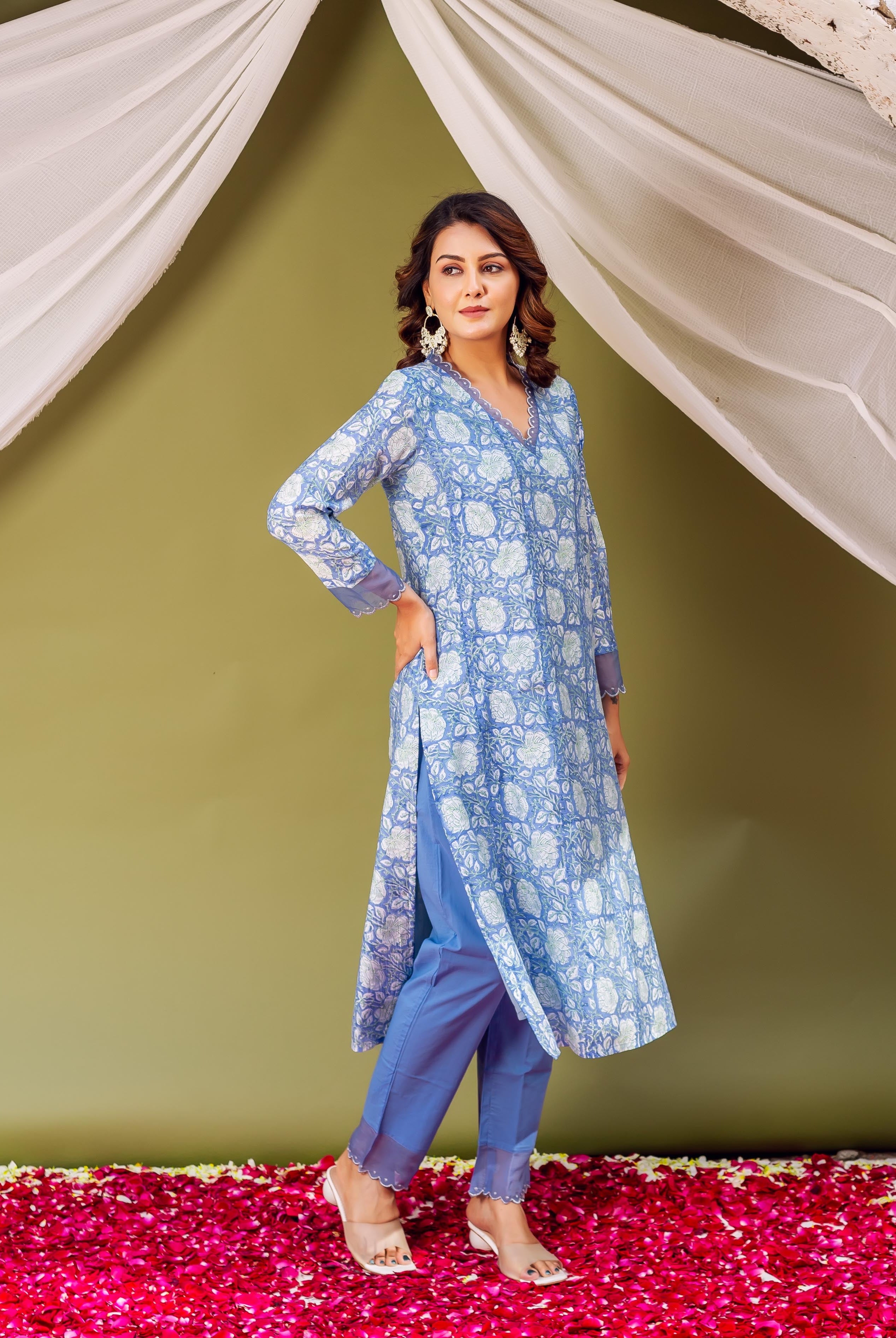 Full-length model in sky blue Chanderi block printed kurta with white floral and scalloped details.