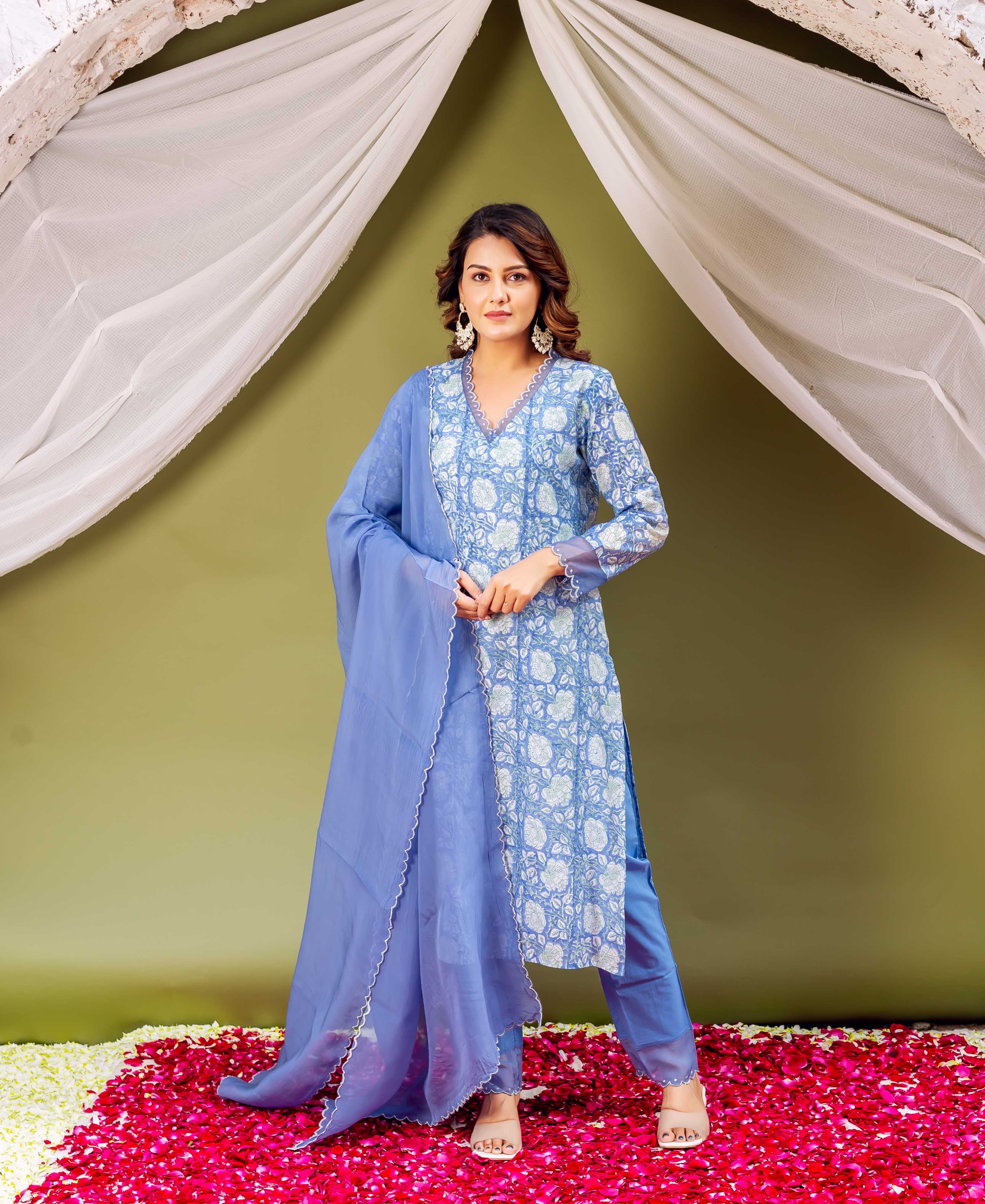 Full-length model wears a blue hand-block-printed kurta set and a solid azure organza dupatta.