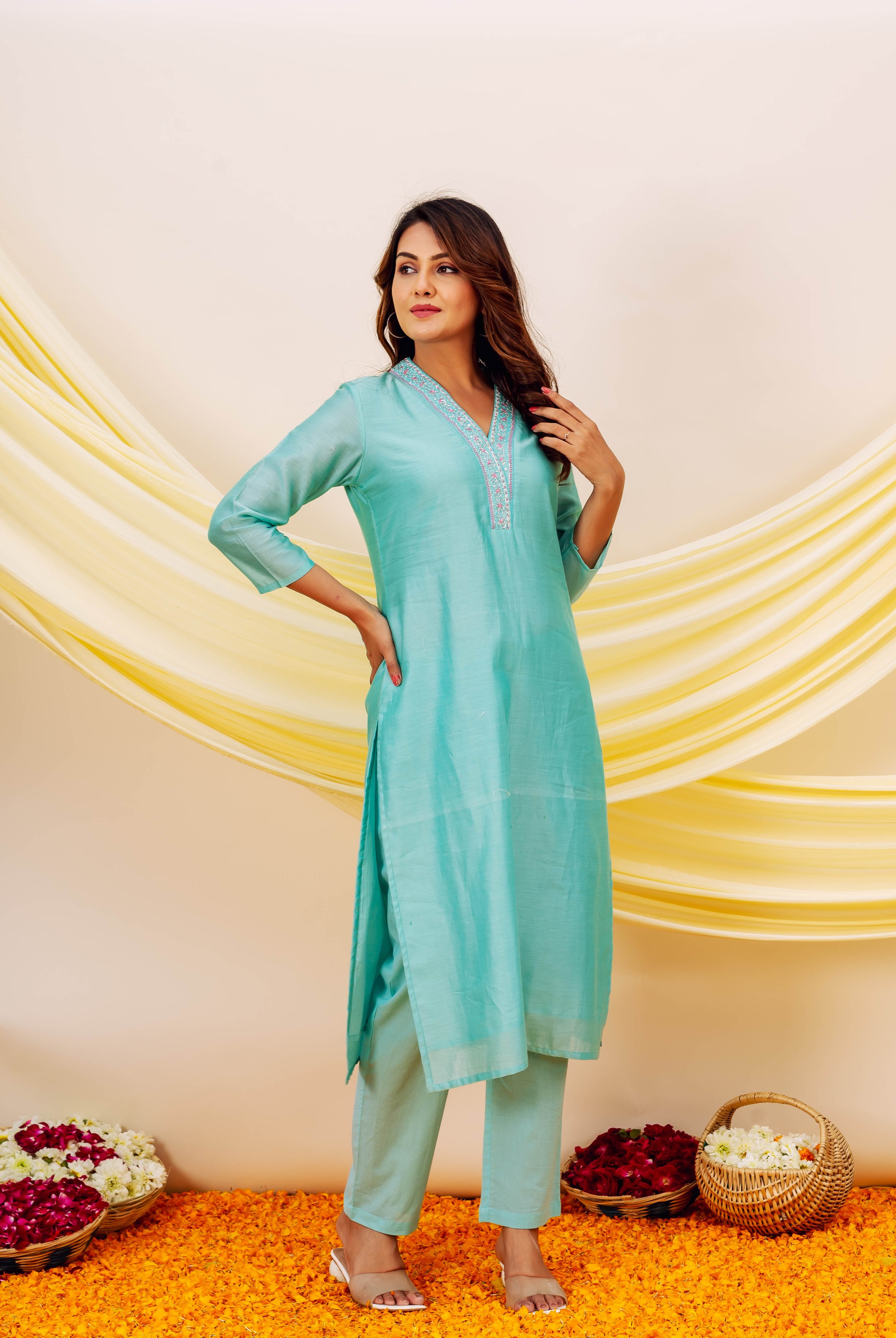 Front full look of model wearing aqua Chanderi silk kurta and matching bottoms with embroidered yoke.