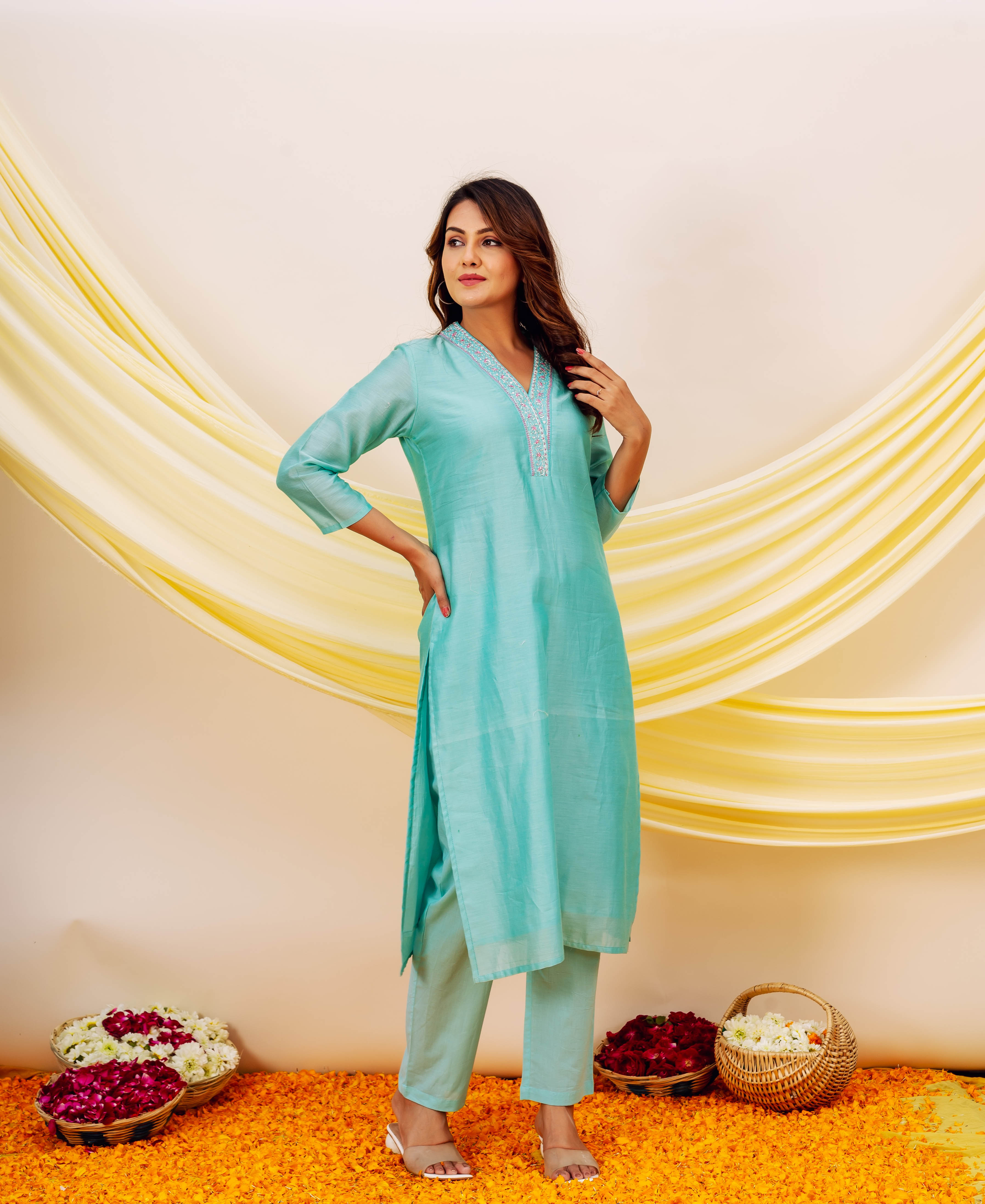 Front full look of model wearing aqua Chanderi silk kurta and matching bottoms with embroidered yoke.