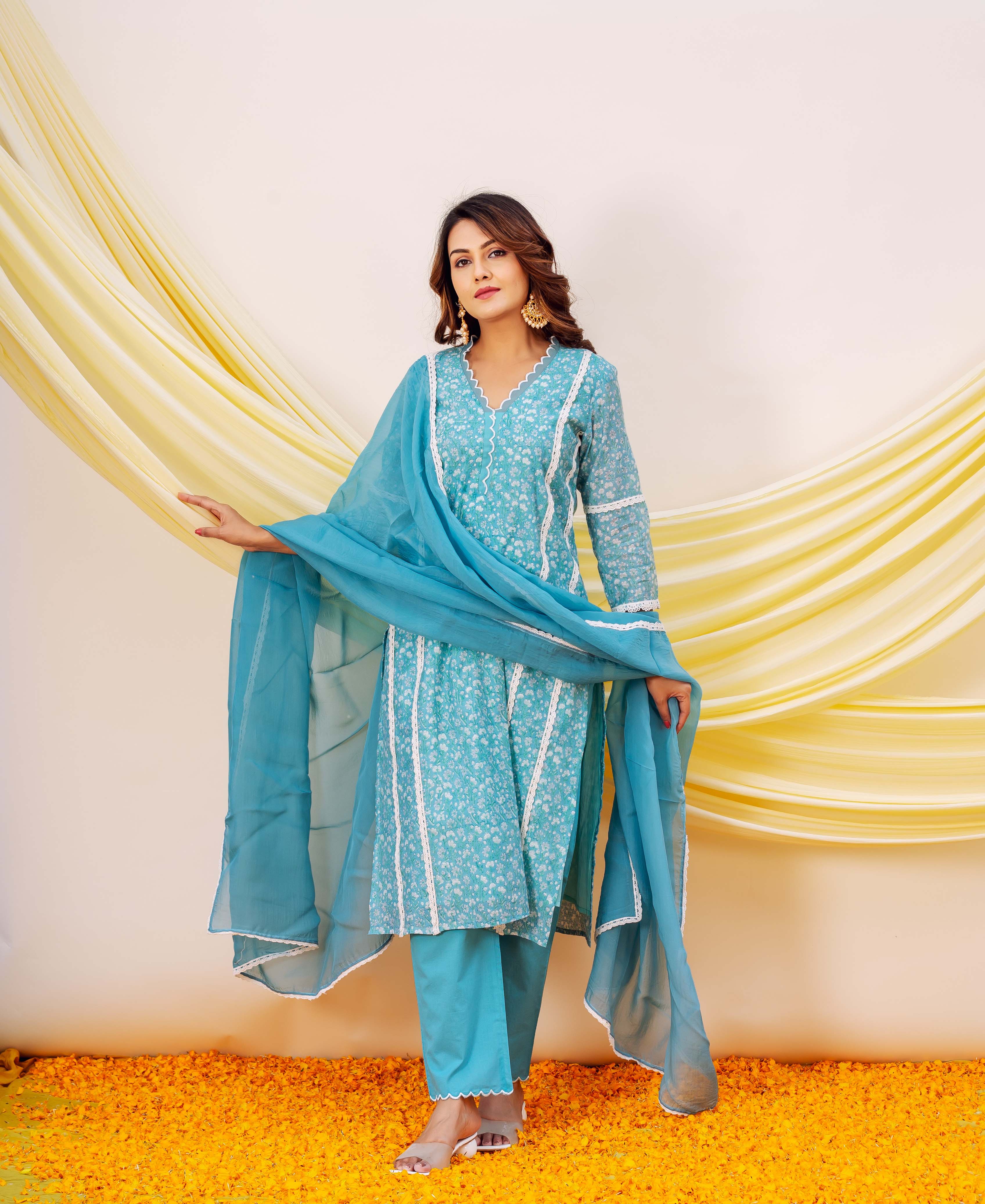 Full front view of a model wearing blue hand-block-printed ethnic suit and organza dupatta.
