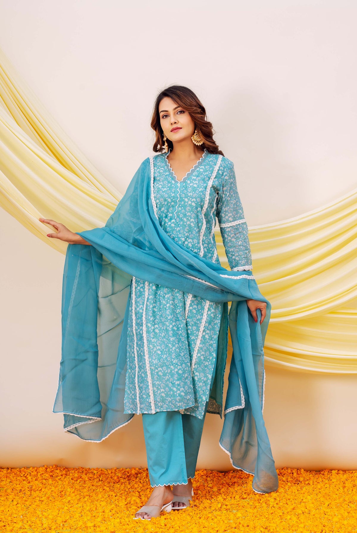 Front view model in blue floral block printed Chanderi kurta set with white lace.
