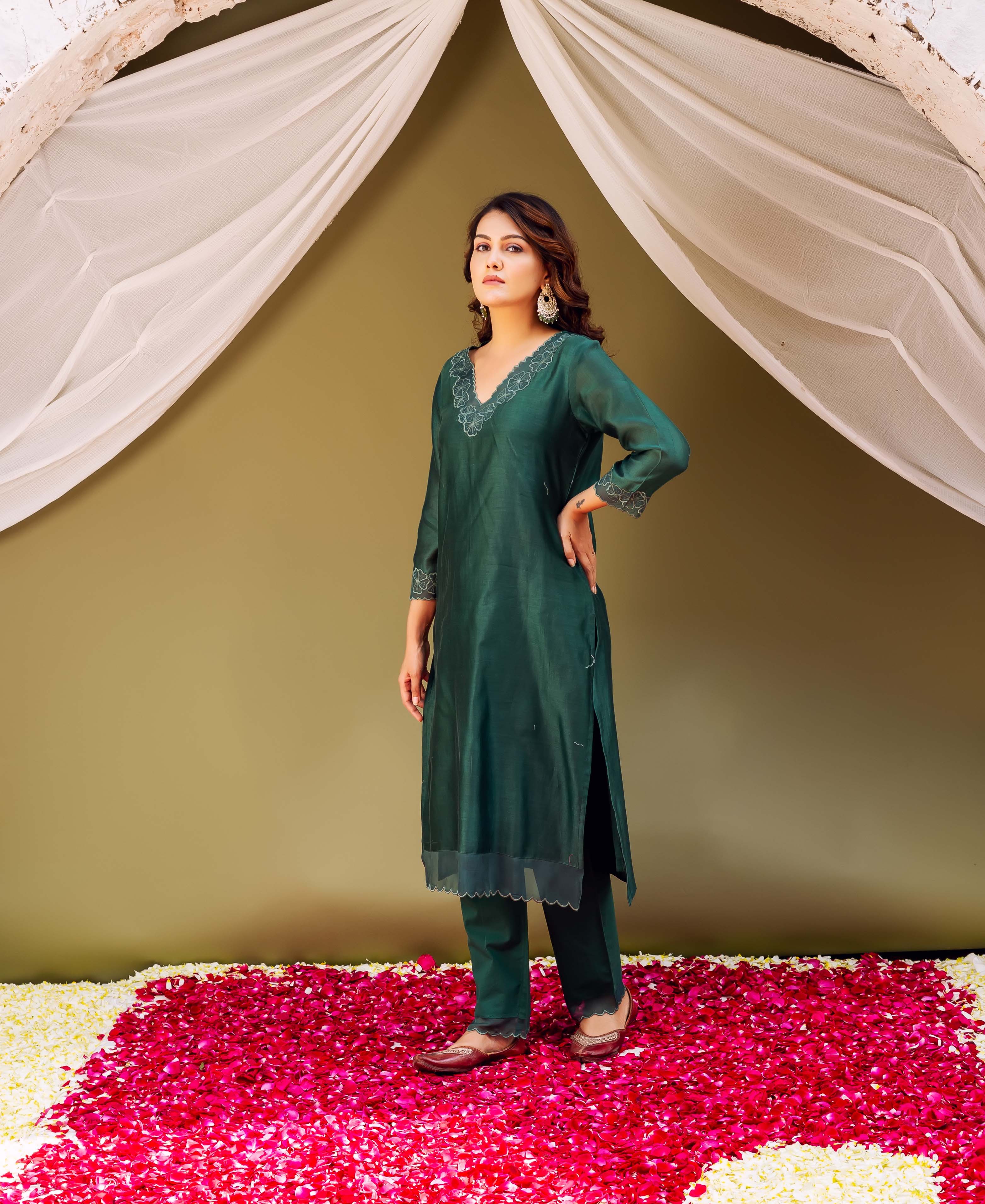 Regal forest green silk Chanderi ensemble with scalloped white embroidery worn by a model.