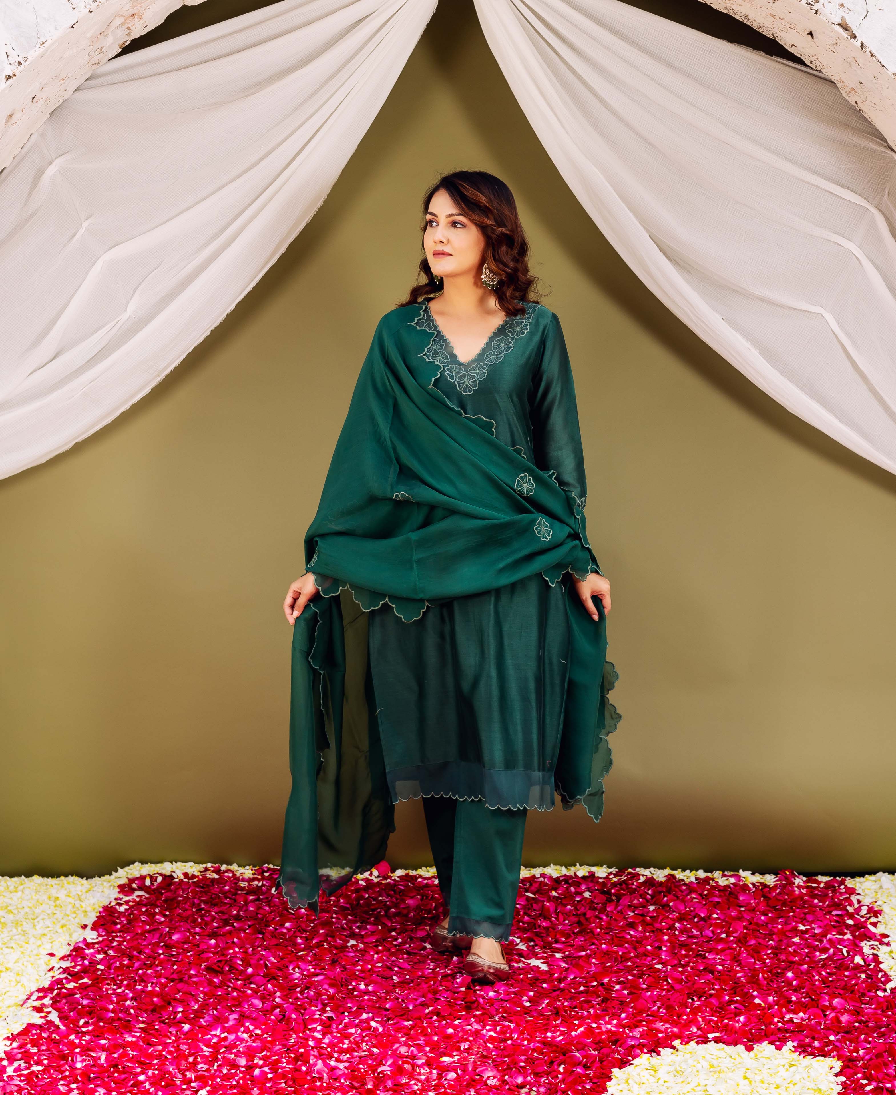 Full-body shot of model in regal forest green silk chanderi hand-block-printed ensemble.