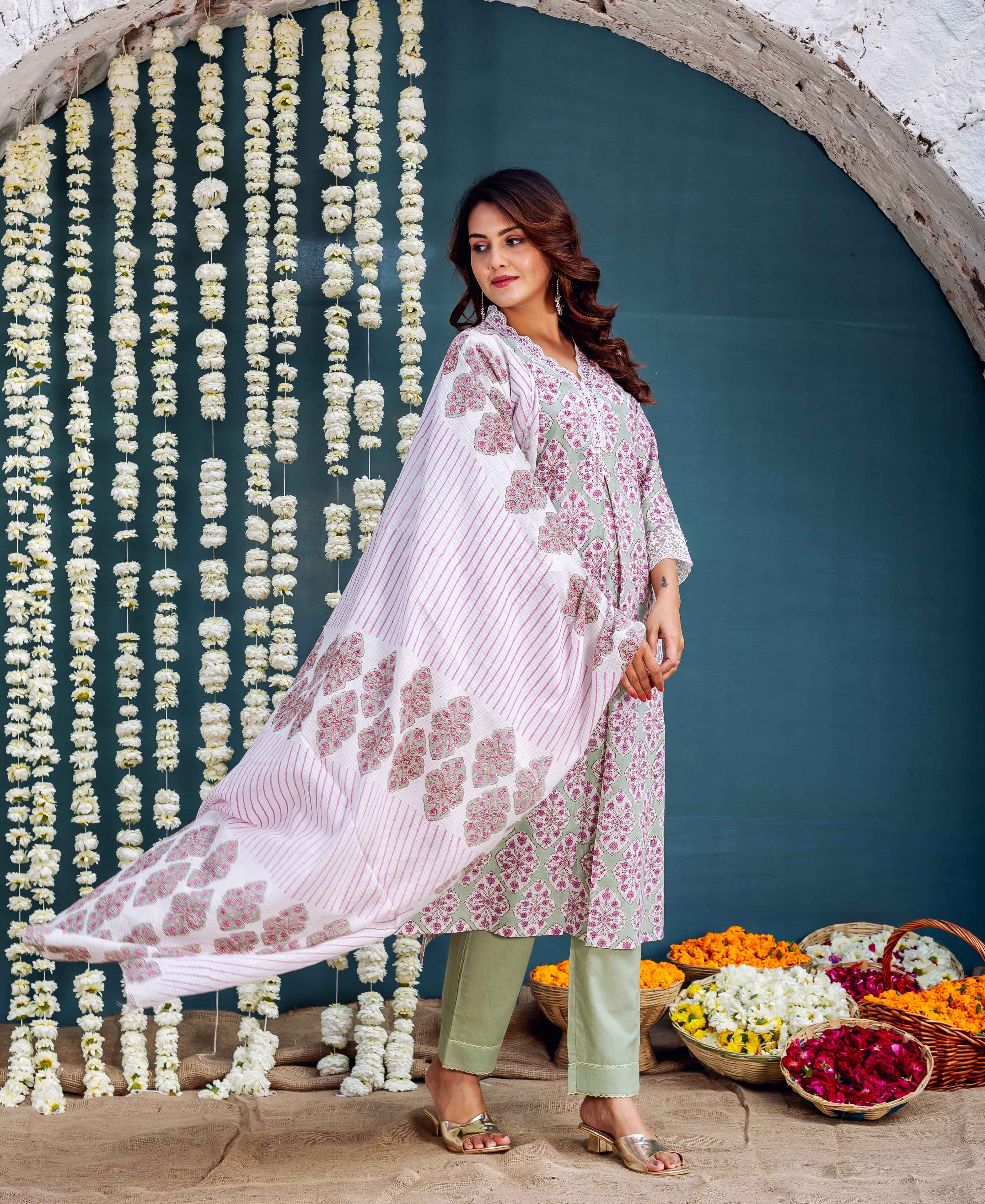 A model wearing a green hand-block-printed kurta with a floral pattern.