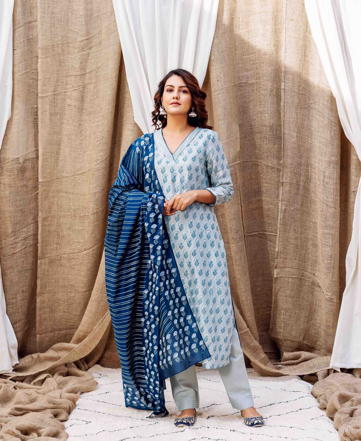 Full-length model in slate hand-block printed kurta with dark blue patterned dupatta.
