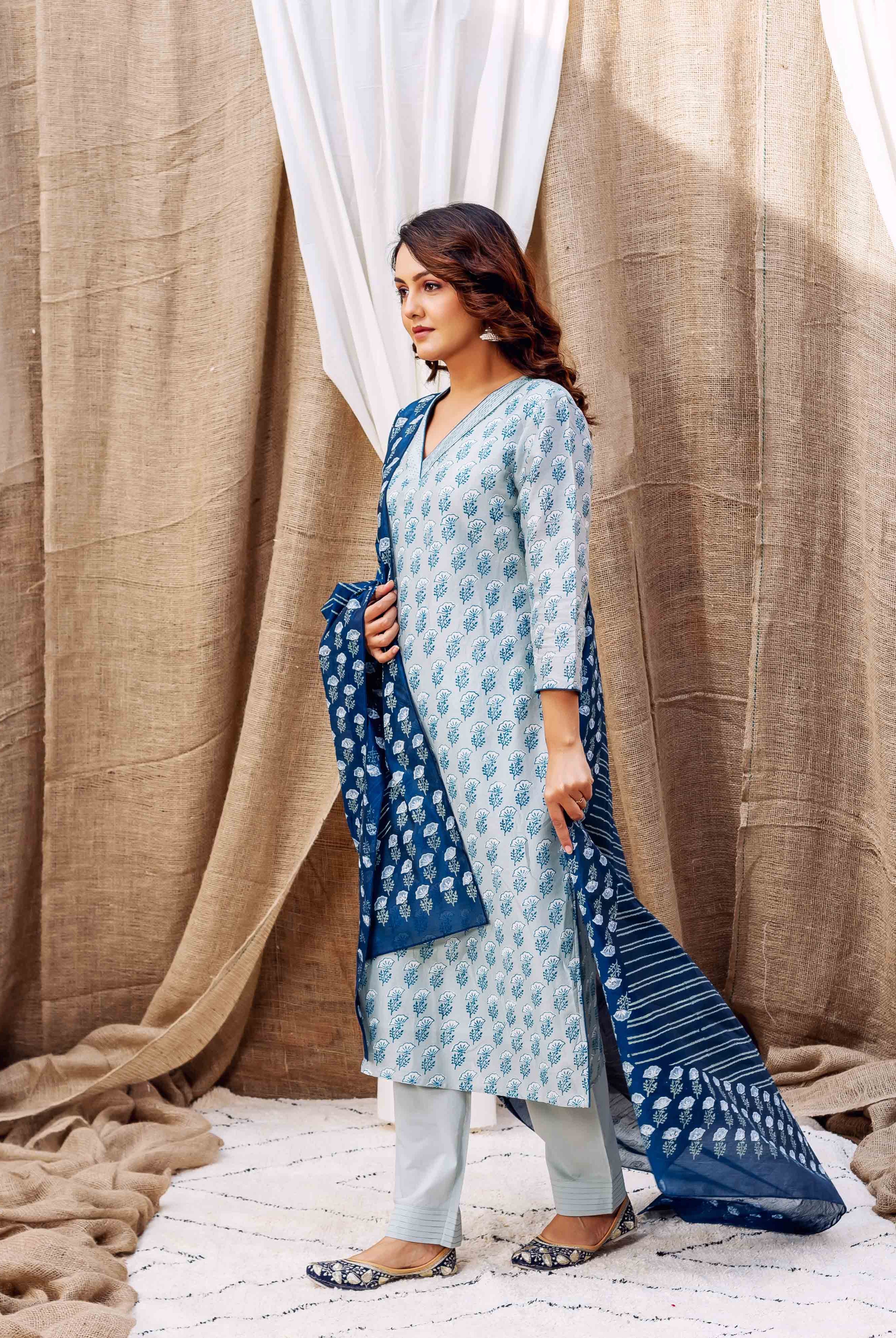 Model in slate hand-block-printed kurta set featuring a leafy pattern and dark blue dupatta.