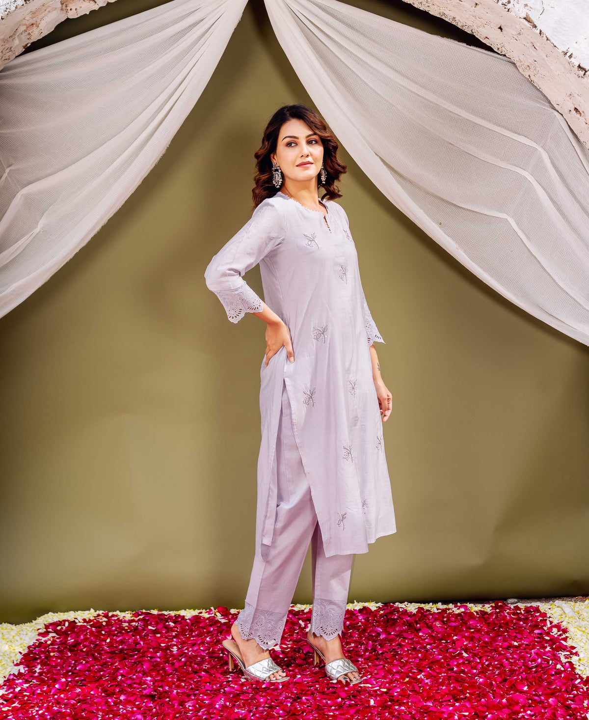 A model wearing a lavender kurta with intricate block prints.