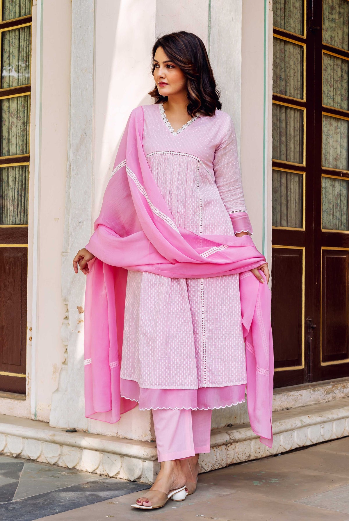 Full look: Model in a blush pink hand-block printed kurta set with dupatta.