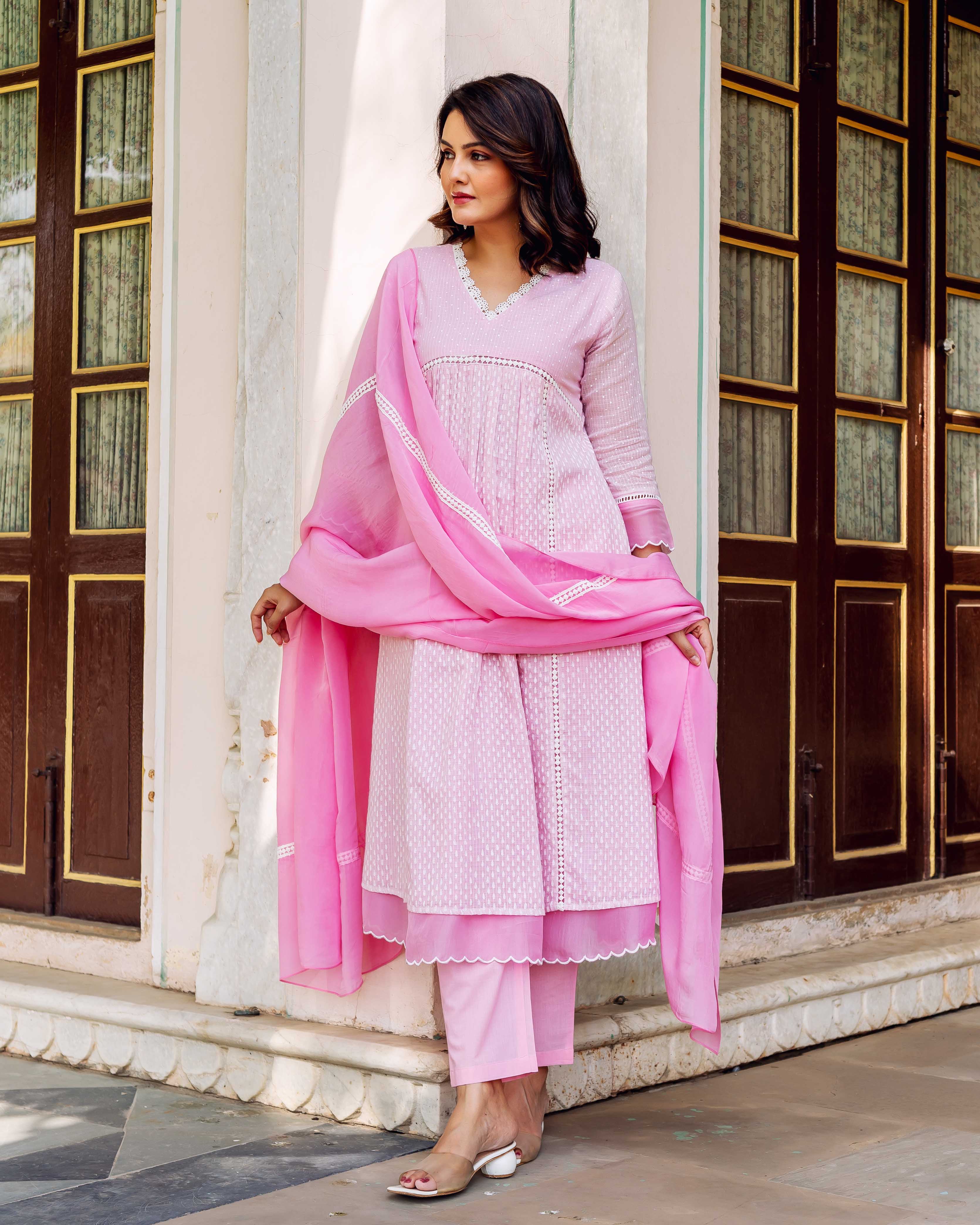 Full look: Model in a blush pink hand-block printed kurta set with dupatta.