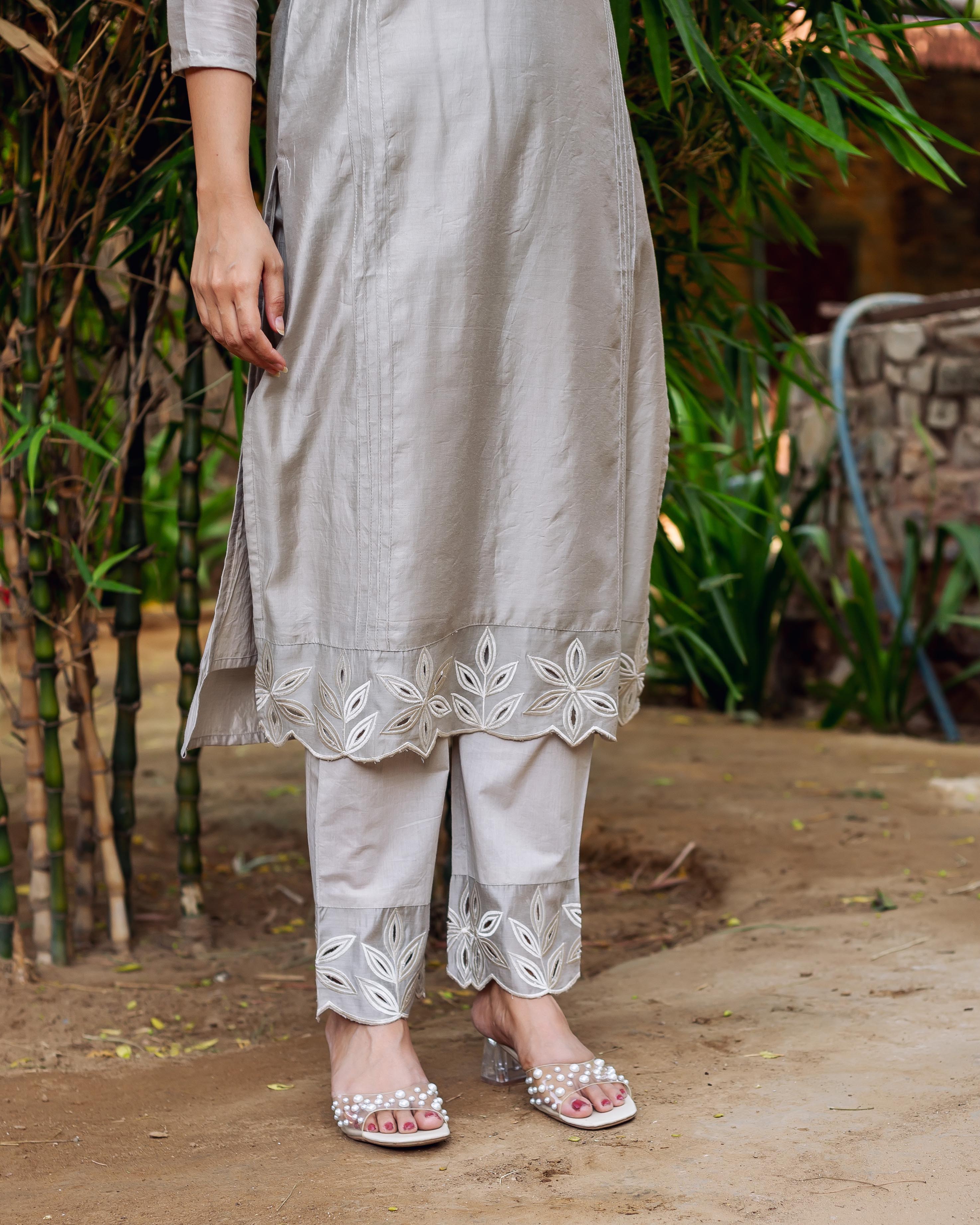Model's lower body in silver mist chanderi silk embroidered kurta and pants set.
