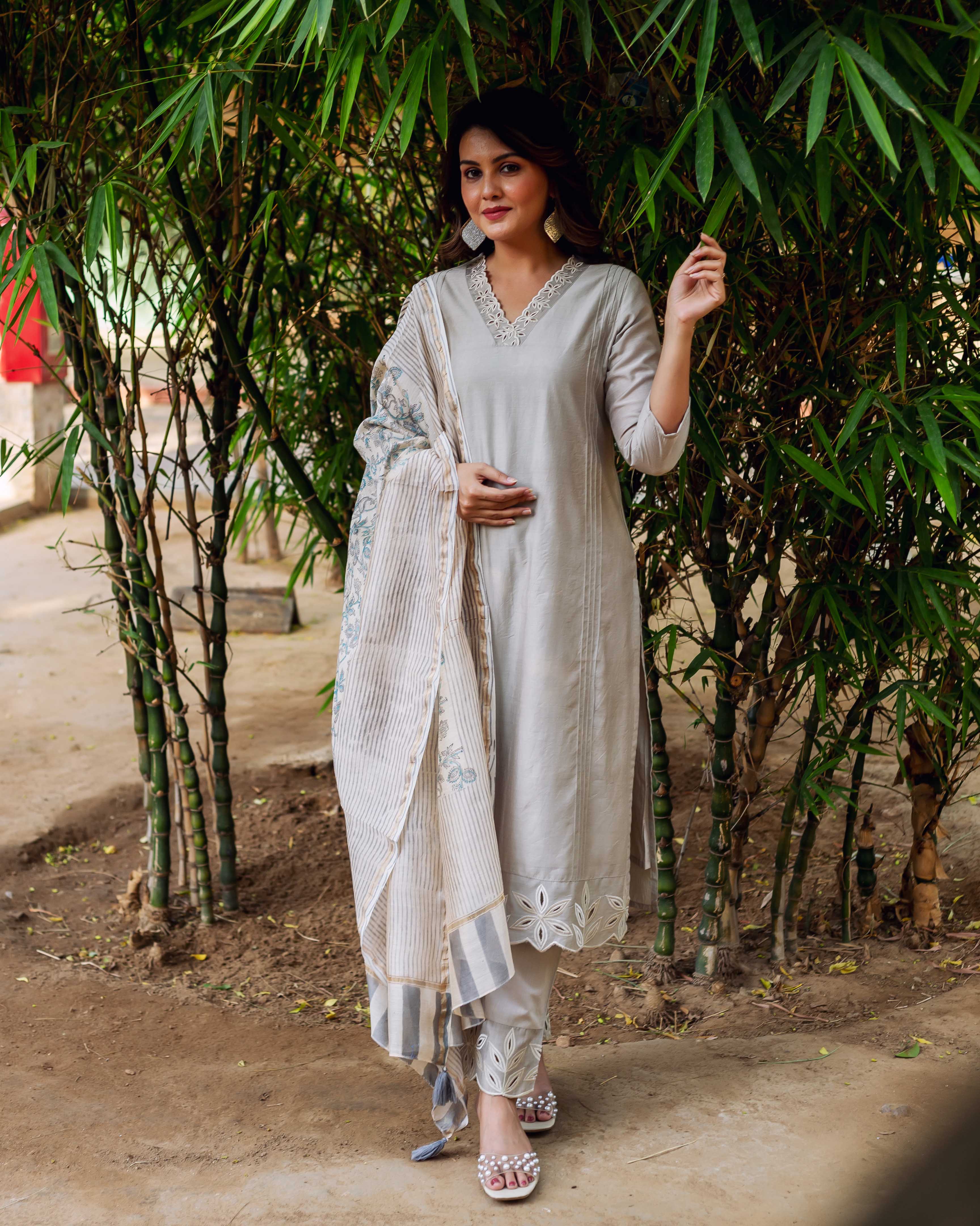 Full-length model wears silver mist embroidered chanderi silk kurta with hand-block-printed dupatta.