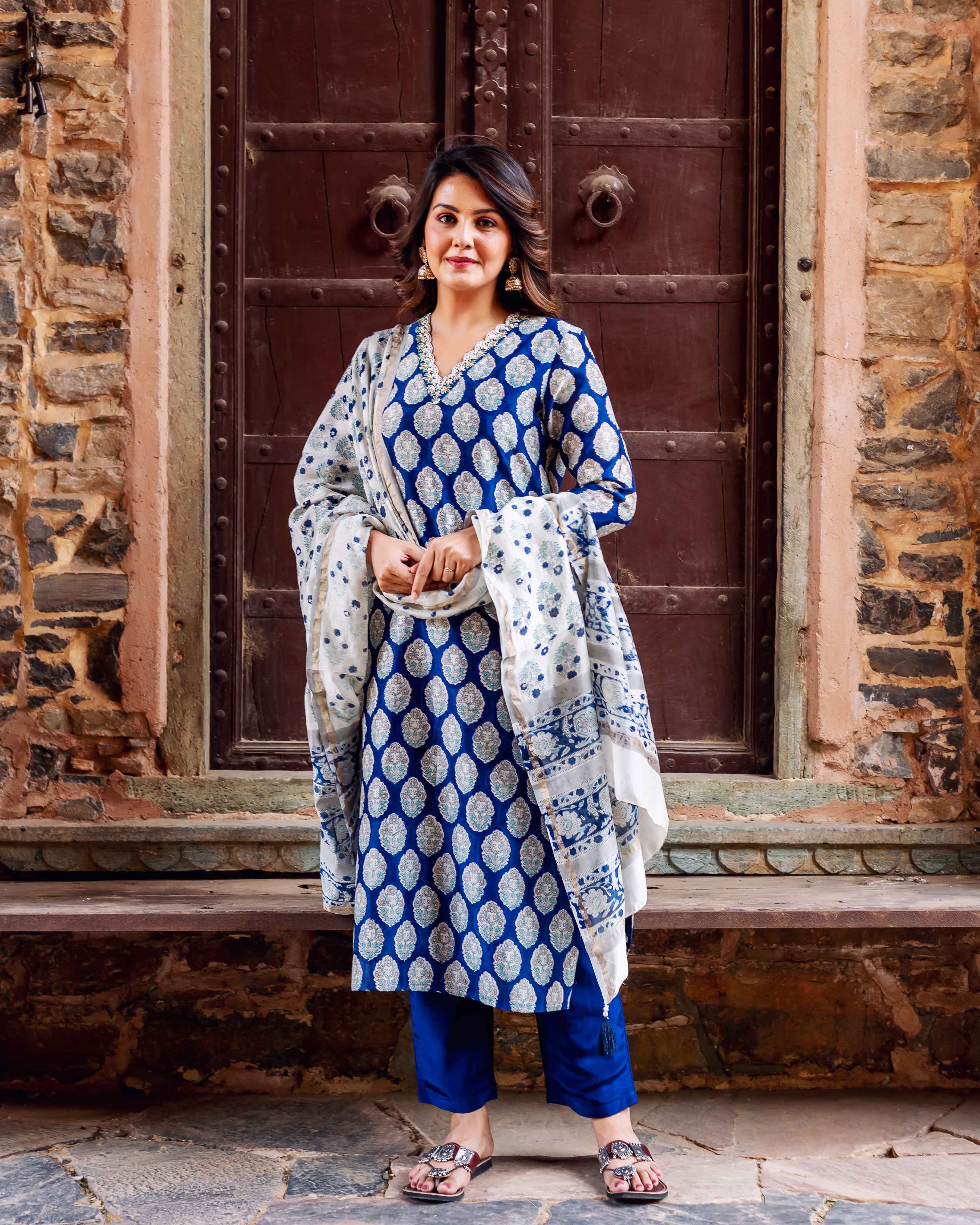 Front full look of model wearing indigo blue hand-block-printed booti kurta set.