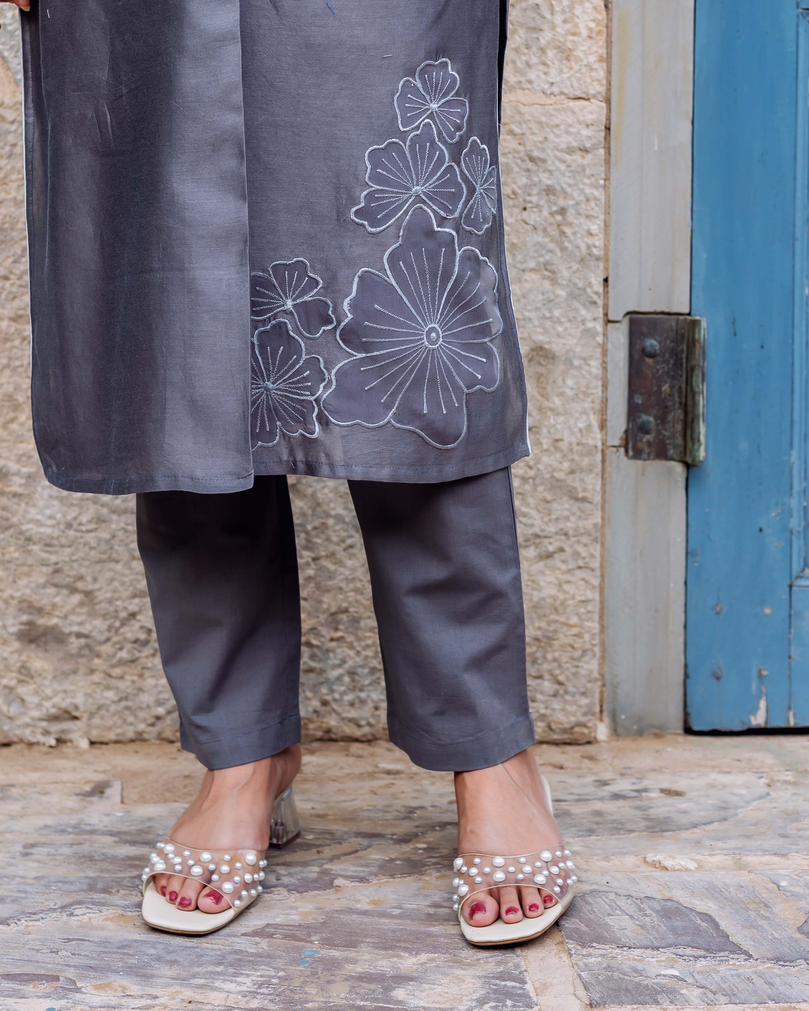 Silver mist chanderi silk kurta featuring white floral embroidery, paired with grey pants.