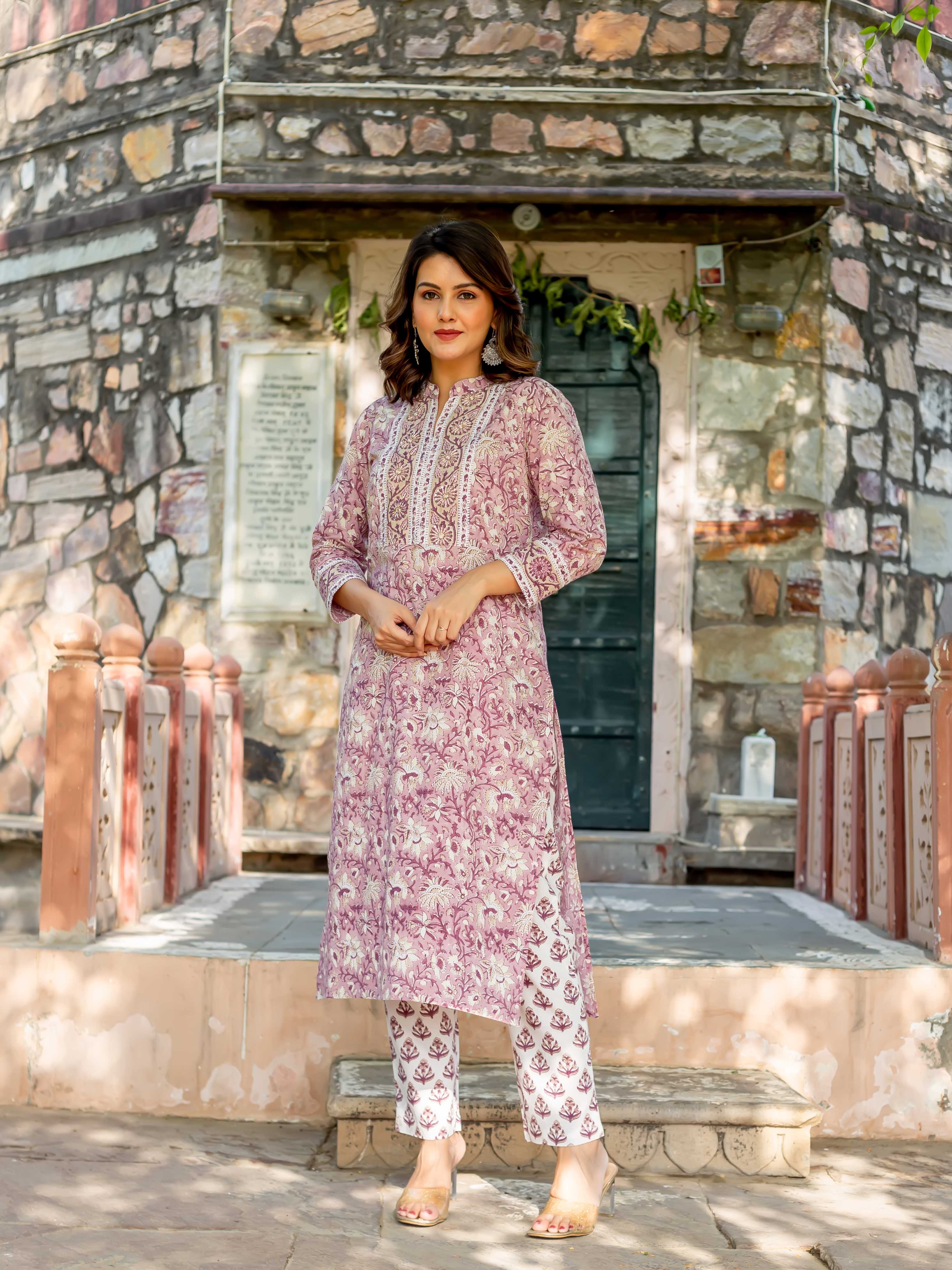 Model wearing an old rose hand-block-printed cotton kurta set with white floral print.