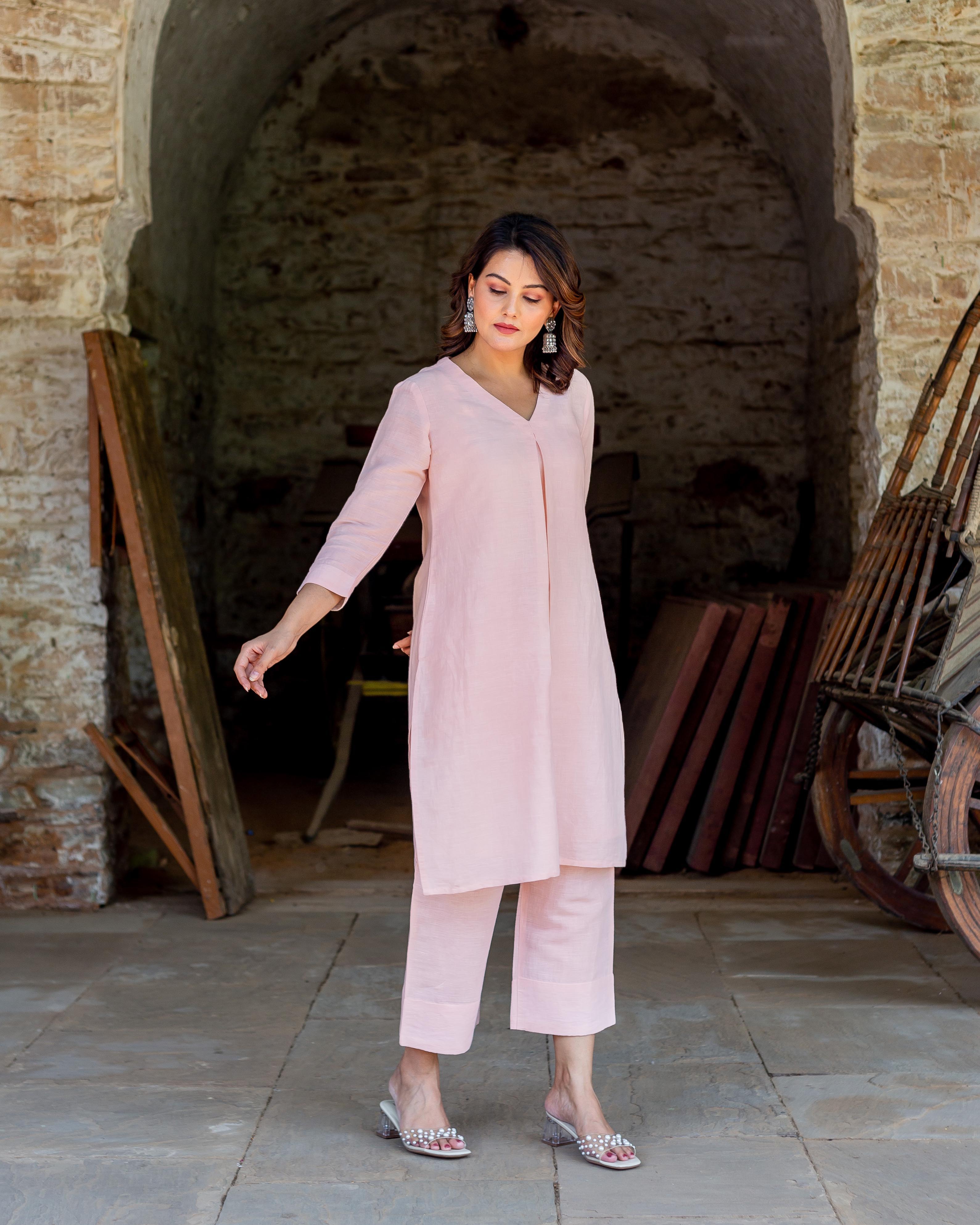 Full front view: model in light pink linen tunic and cropped pants co-ord set.