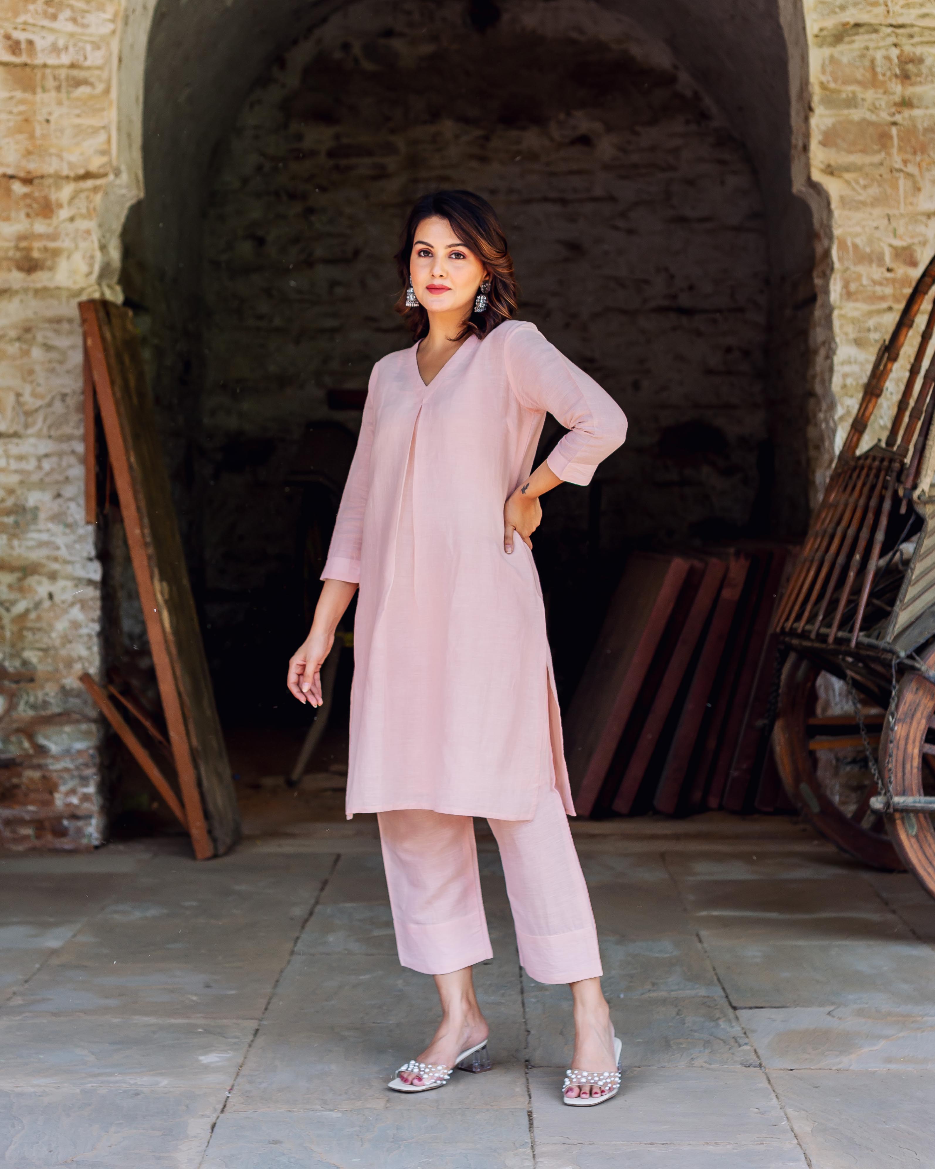 Full front view of a model wearing a light pink linen co-ord set.