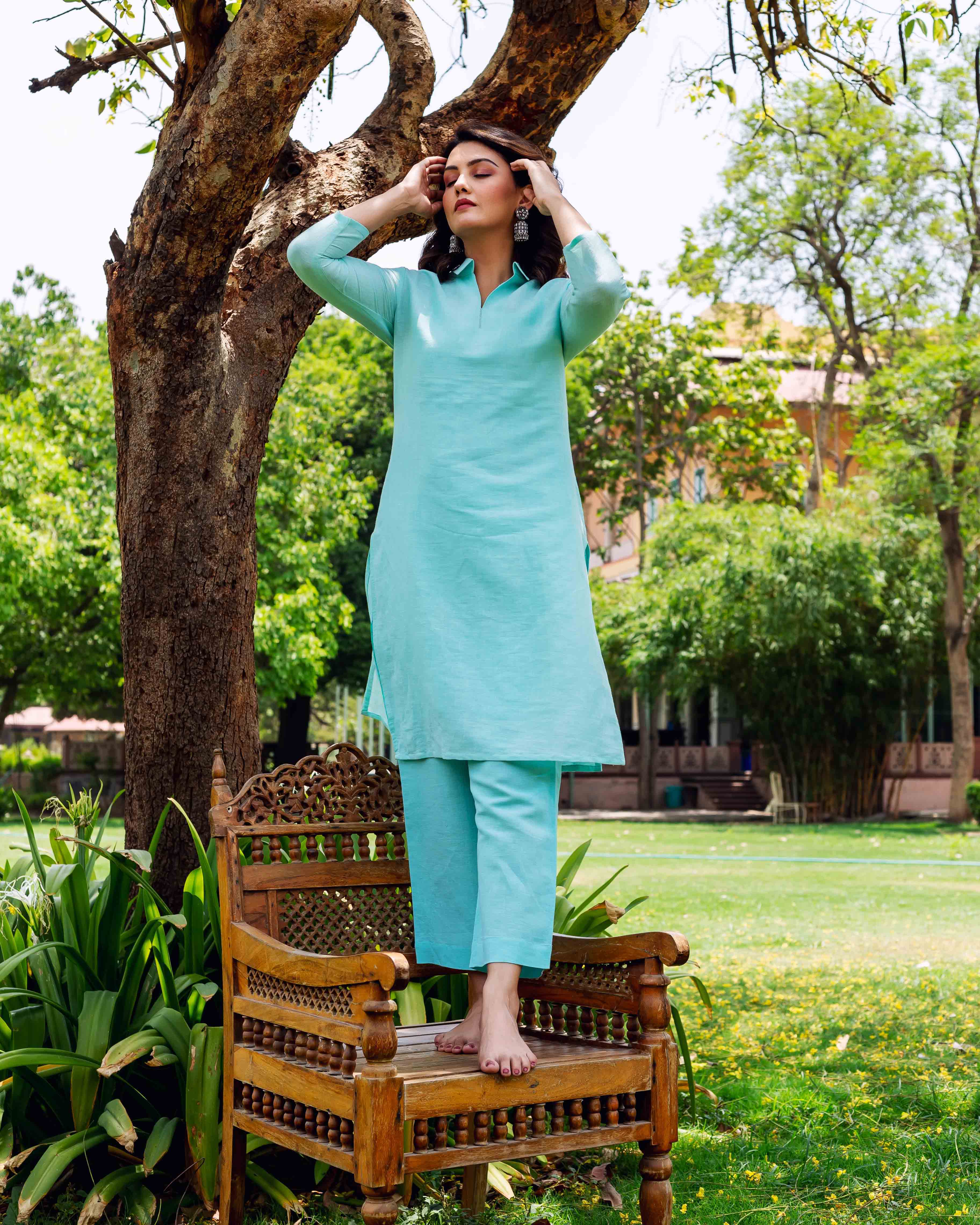 Model in bright sky blue plain linen co-ord set, full look, front view.