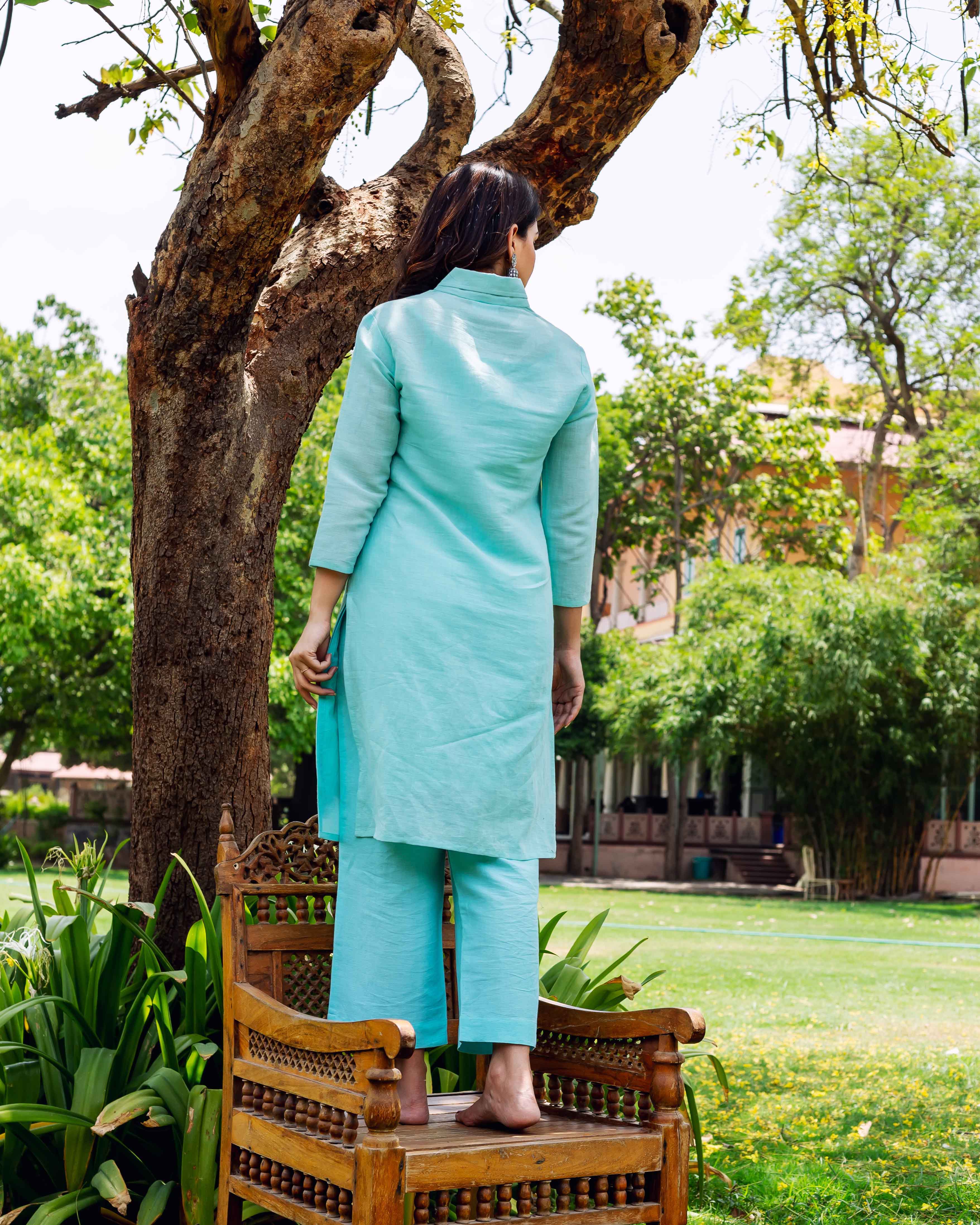 On model, back view, full look of a solid bright sky linen co-ord set.