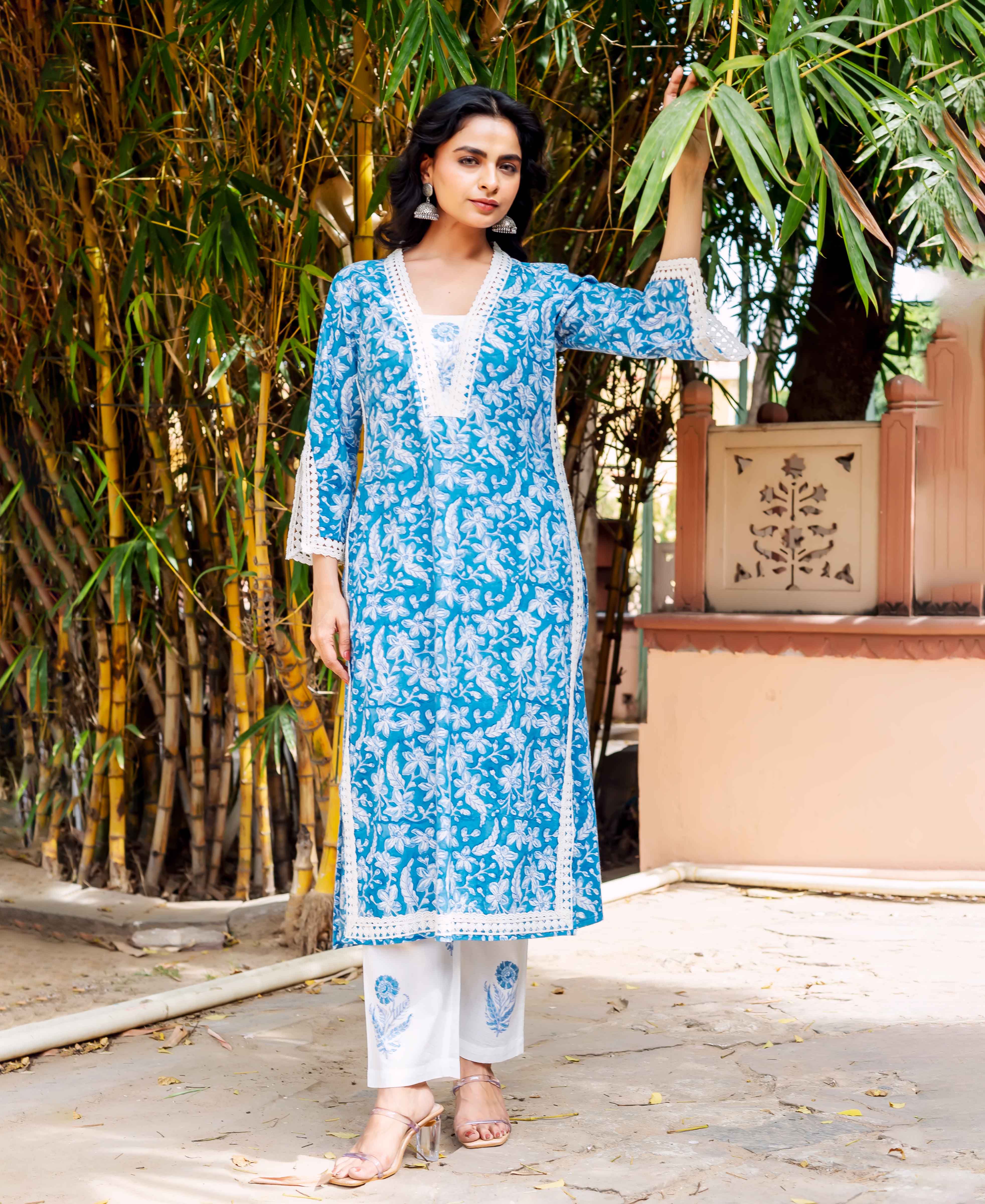 Front view model in blue and white floral hand-block printed kurta set with lace details.