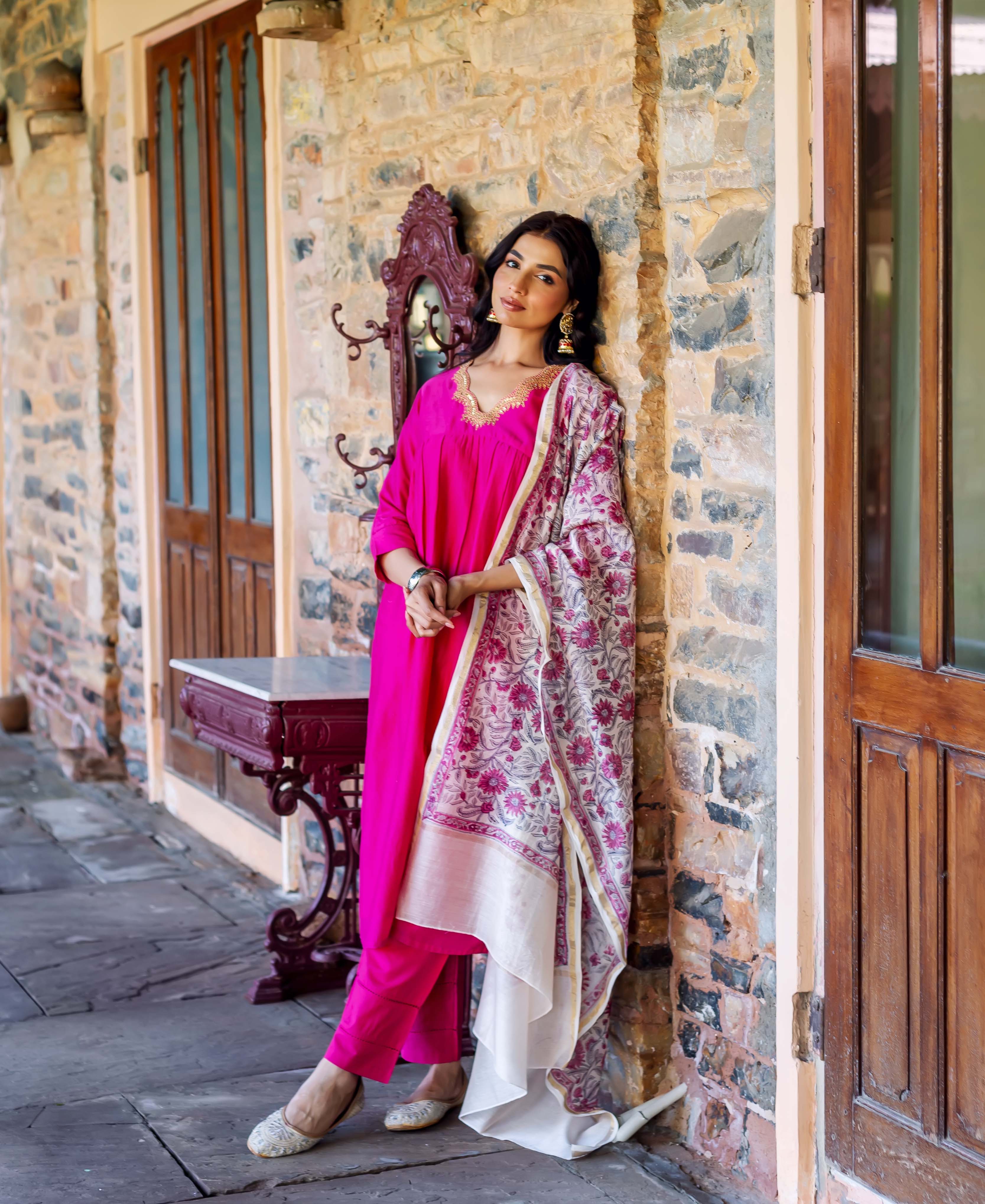 Full-length model in radiant pink Chanderi silk kurta, with a floral block-printed dupatta.