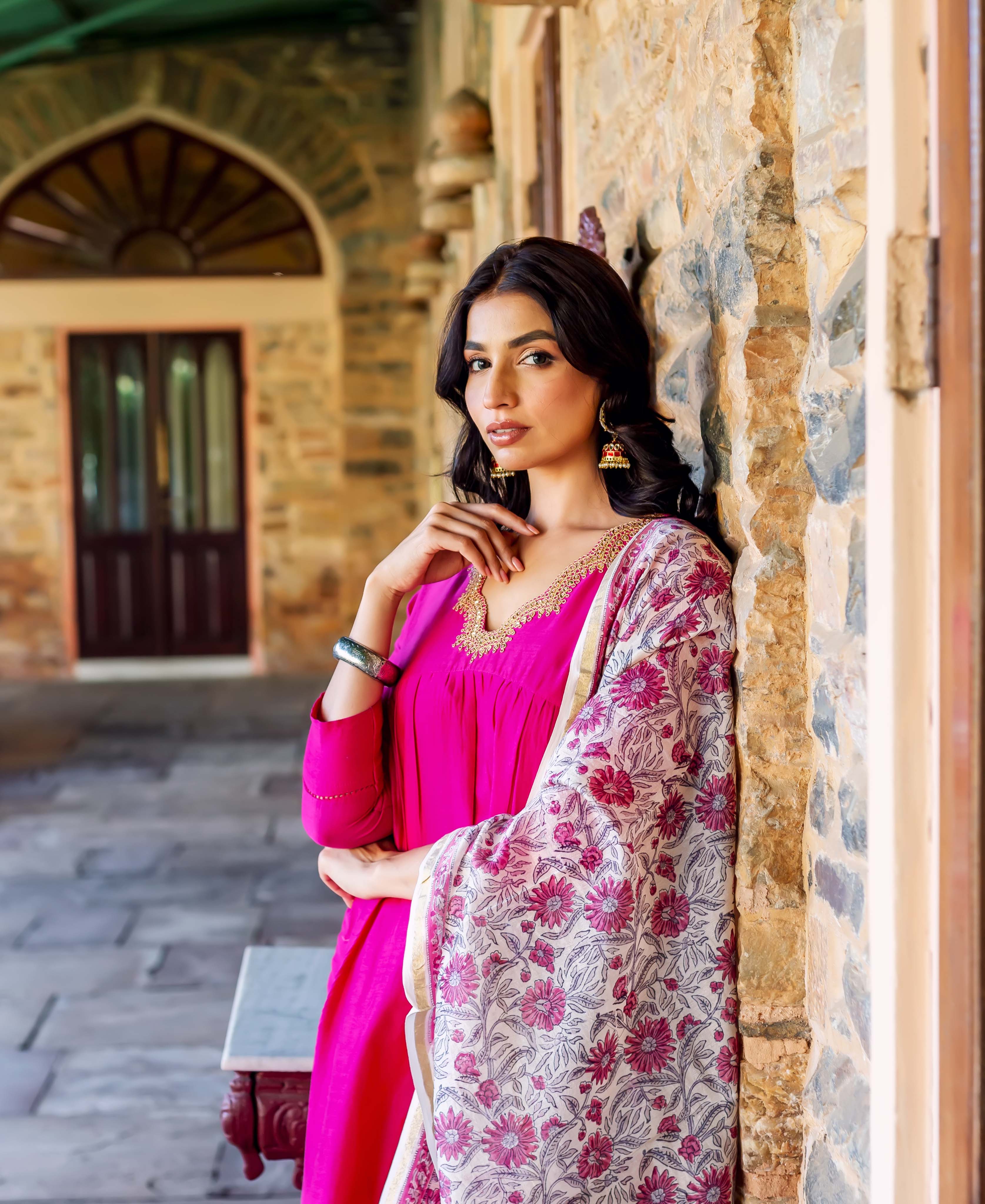 Model wears a radiant pink Chanderi silk kurta with hand-block-printed floral dupatta.