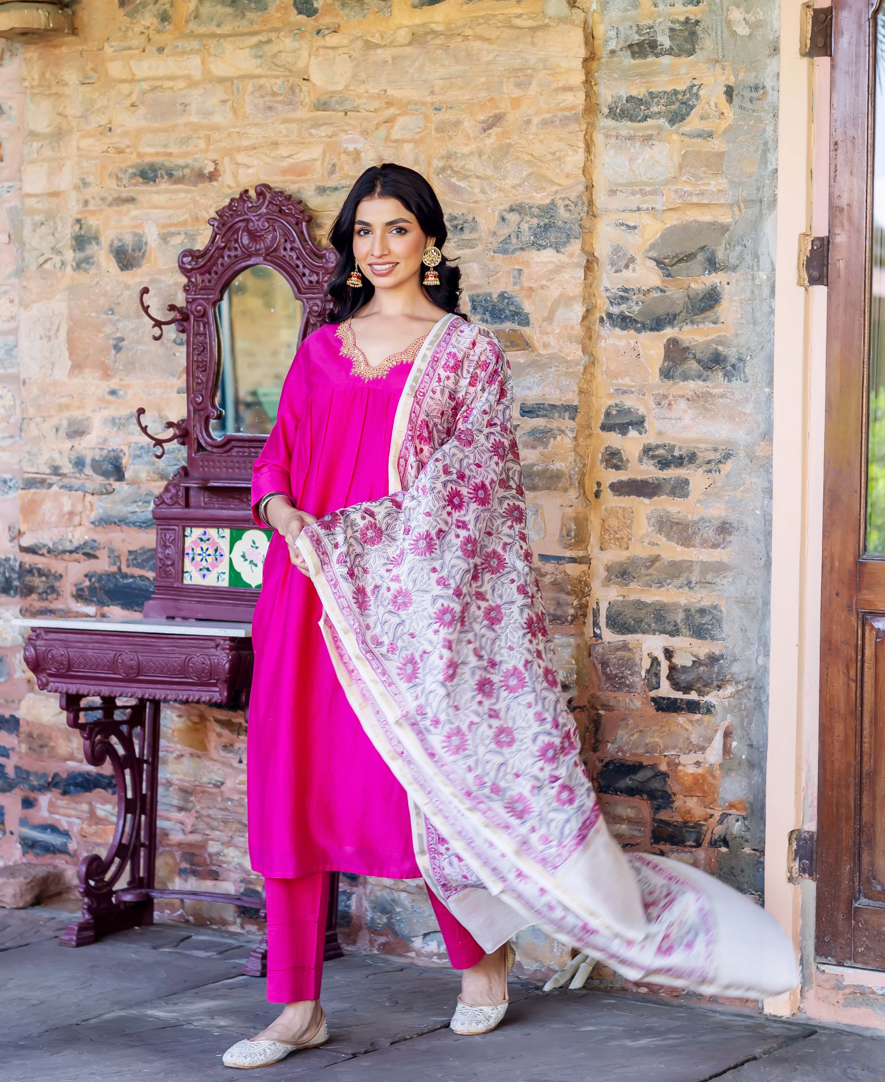 Model in radiant pink chanderi silk kurta set with a flowing floral hand-block printed dupatta.