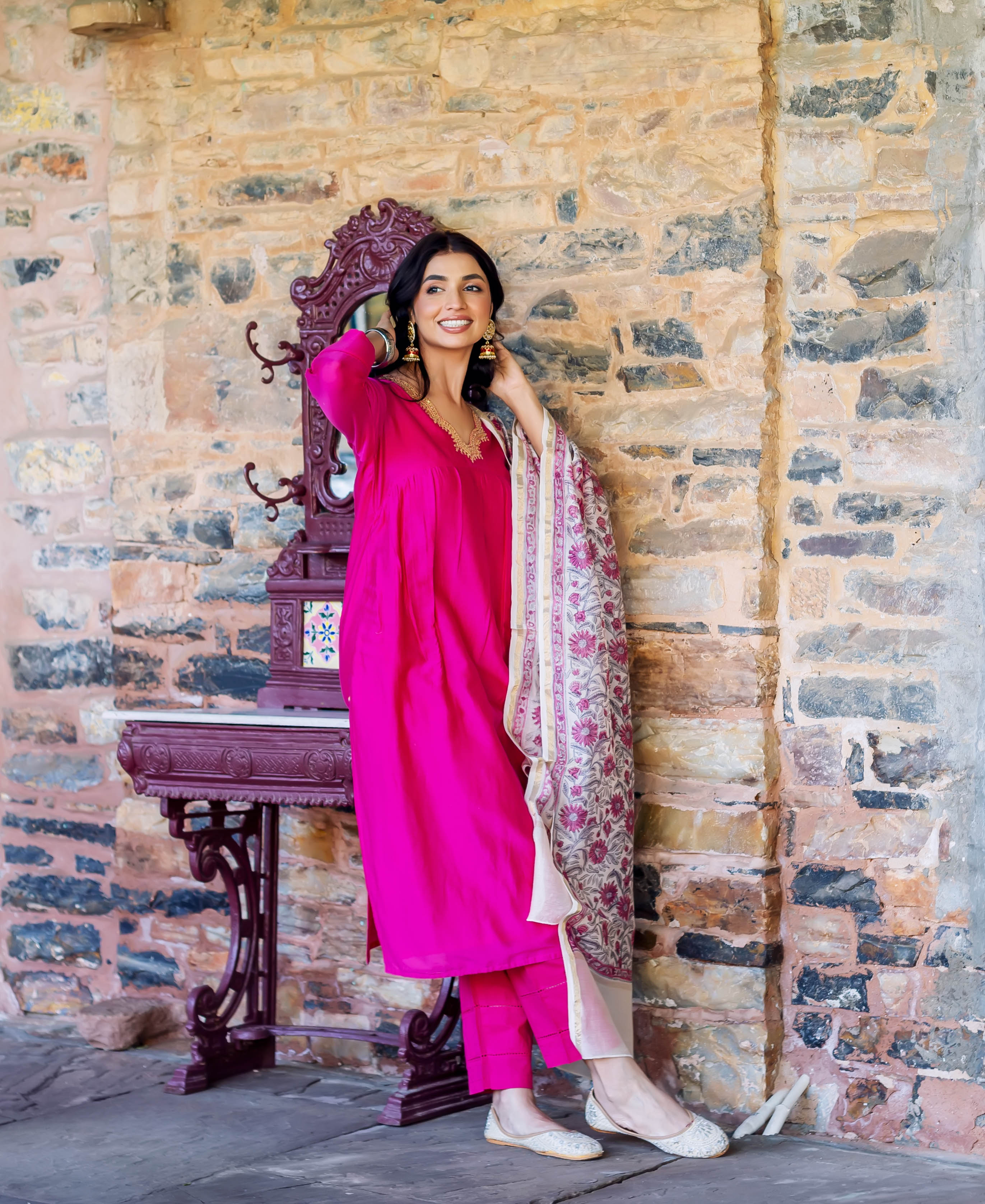 Model in radiant pink chanderi silk kurta with hand-block-printed floral off-white dupatta.