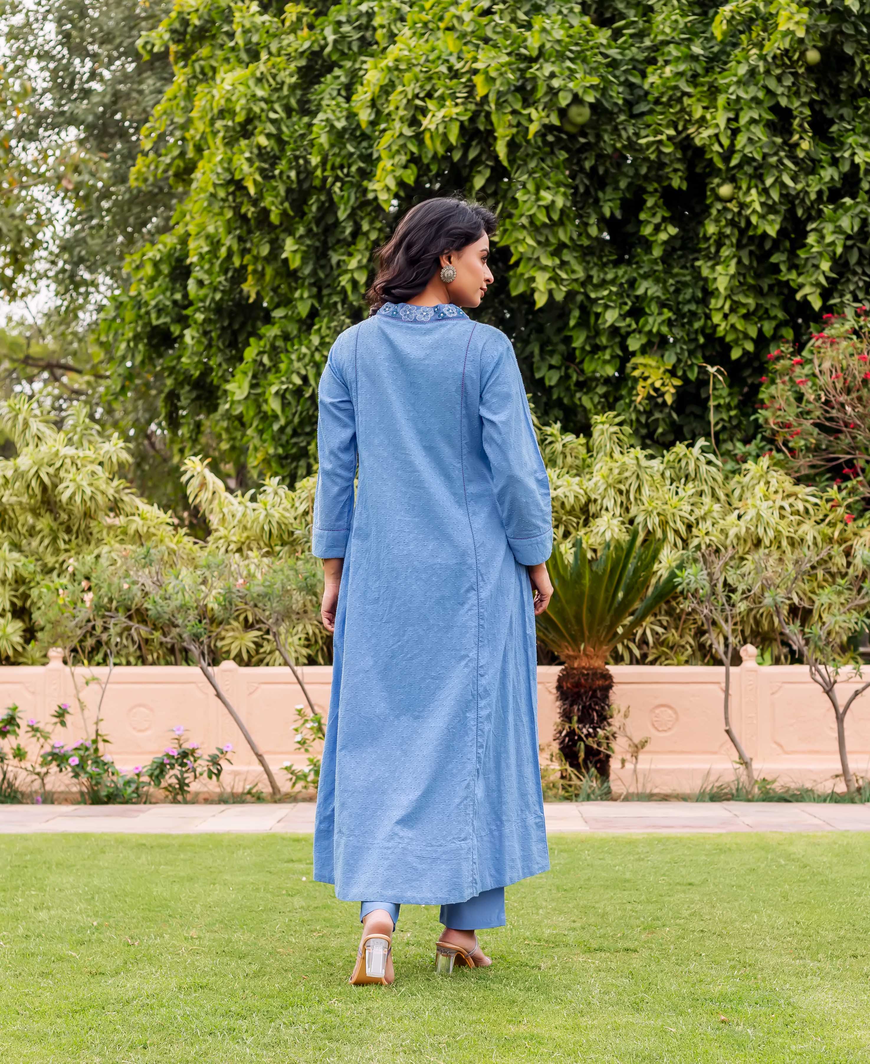 Sky blue cotton Anarkali kurta on model from behind, showing printed collar and matching pants.