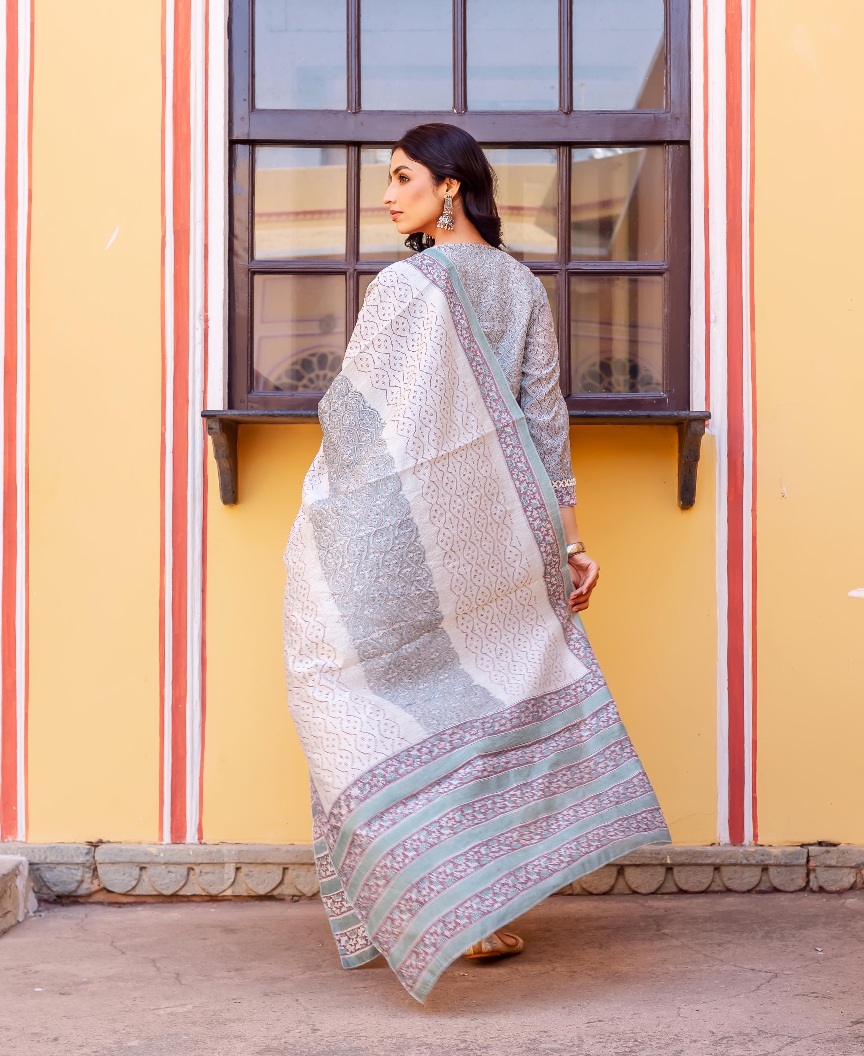 Rear view: Model in grey block-printed Chanderi kurta with white, blue, maroon patterned dupatta.
