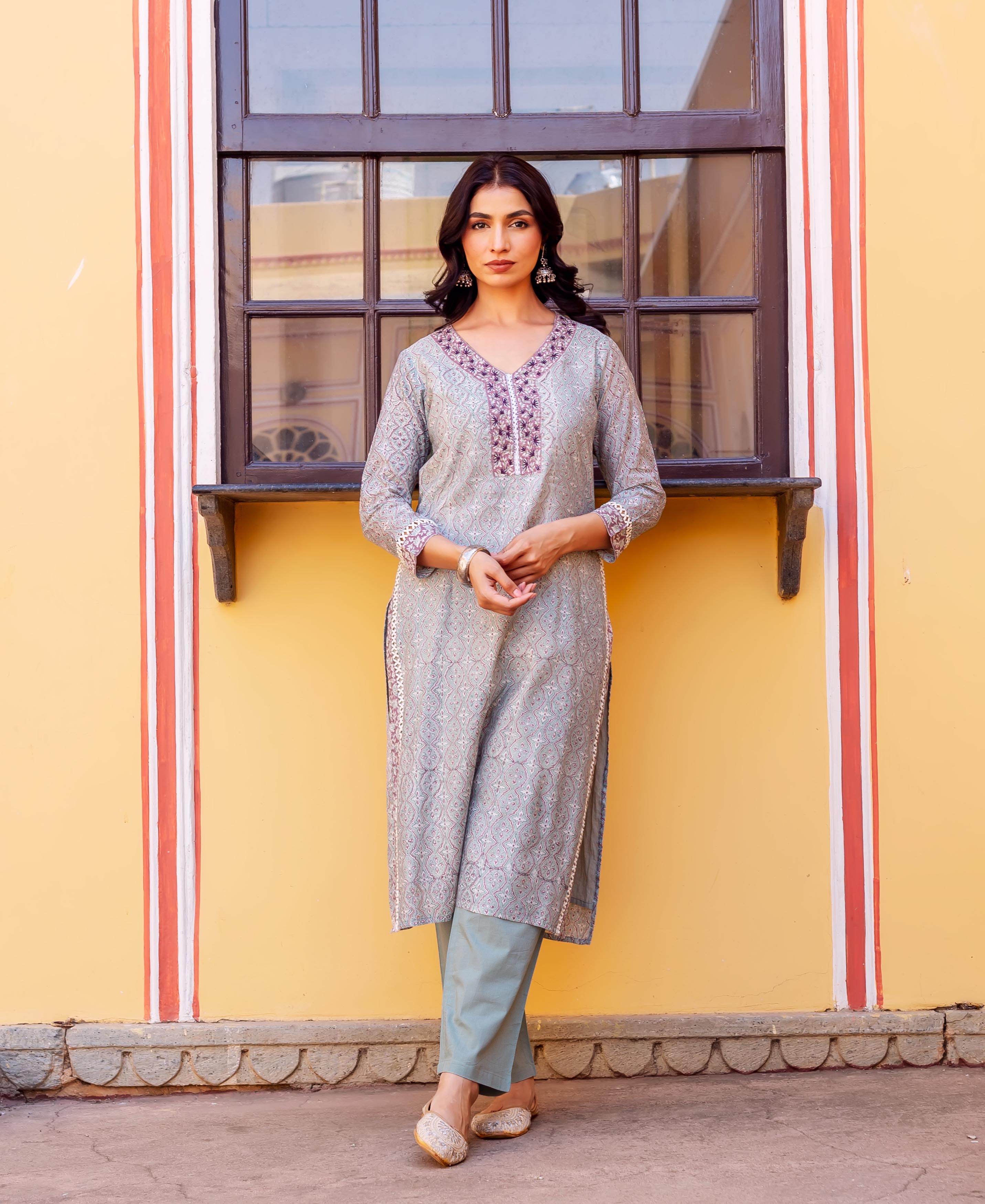 Full body model in a grey block-printed Chanderi kurta with purple V-neck embroidery.