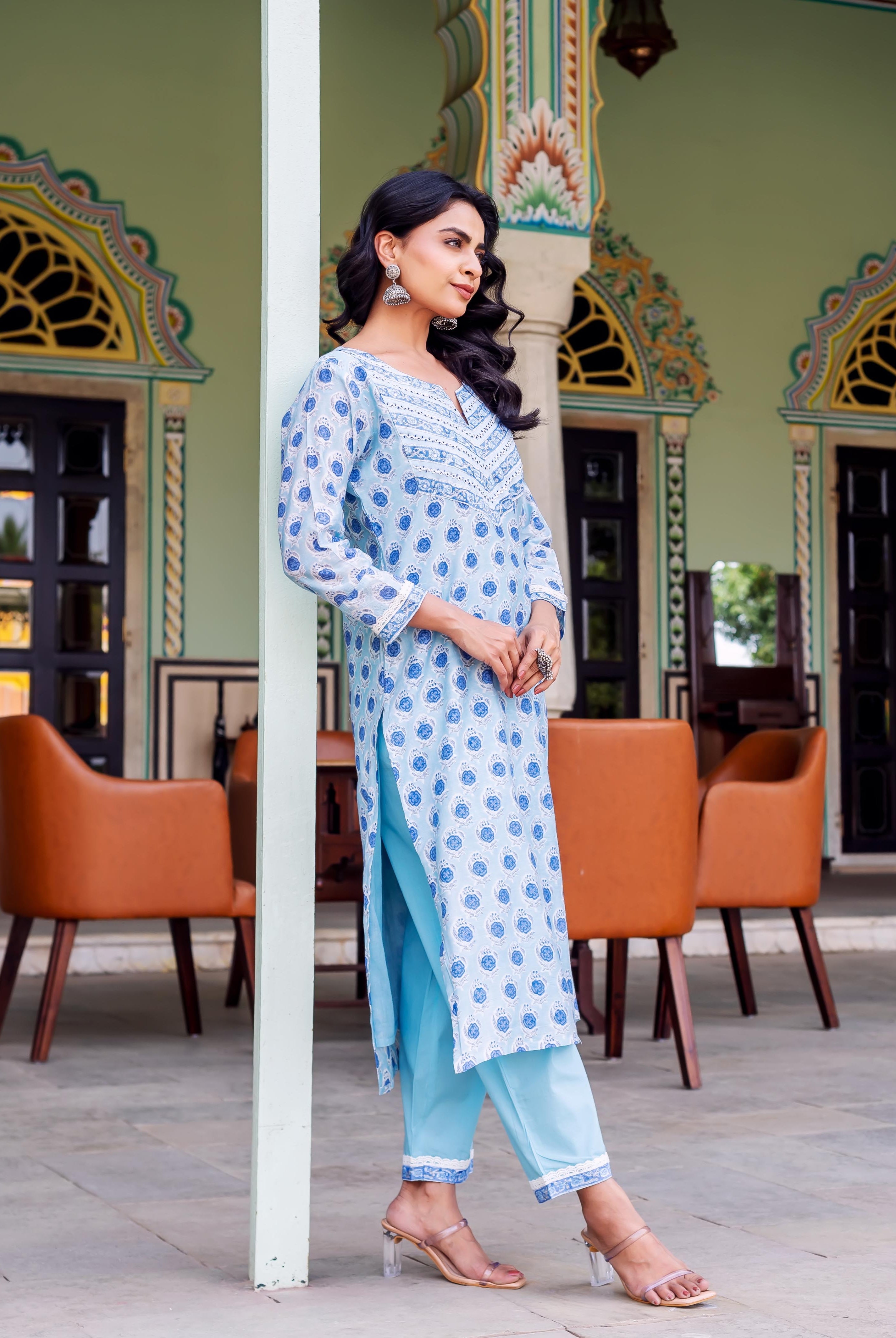 Full shot of a woman in a light blue hand-block-printed kurta with matching plain blue pants.